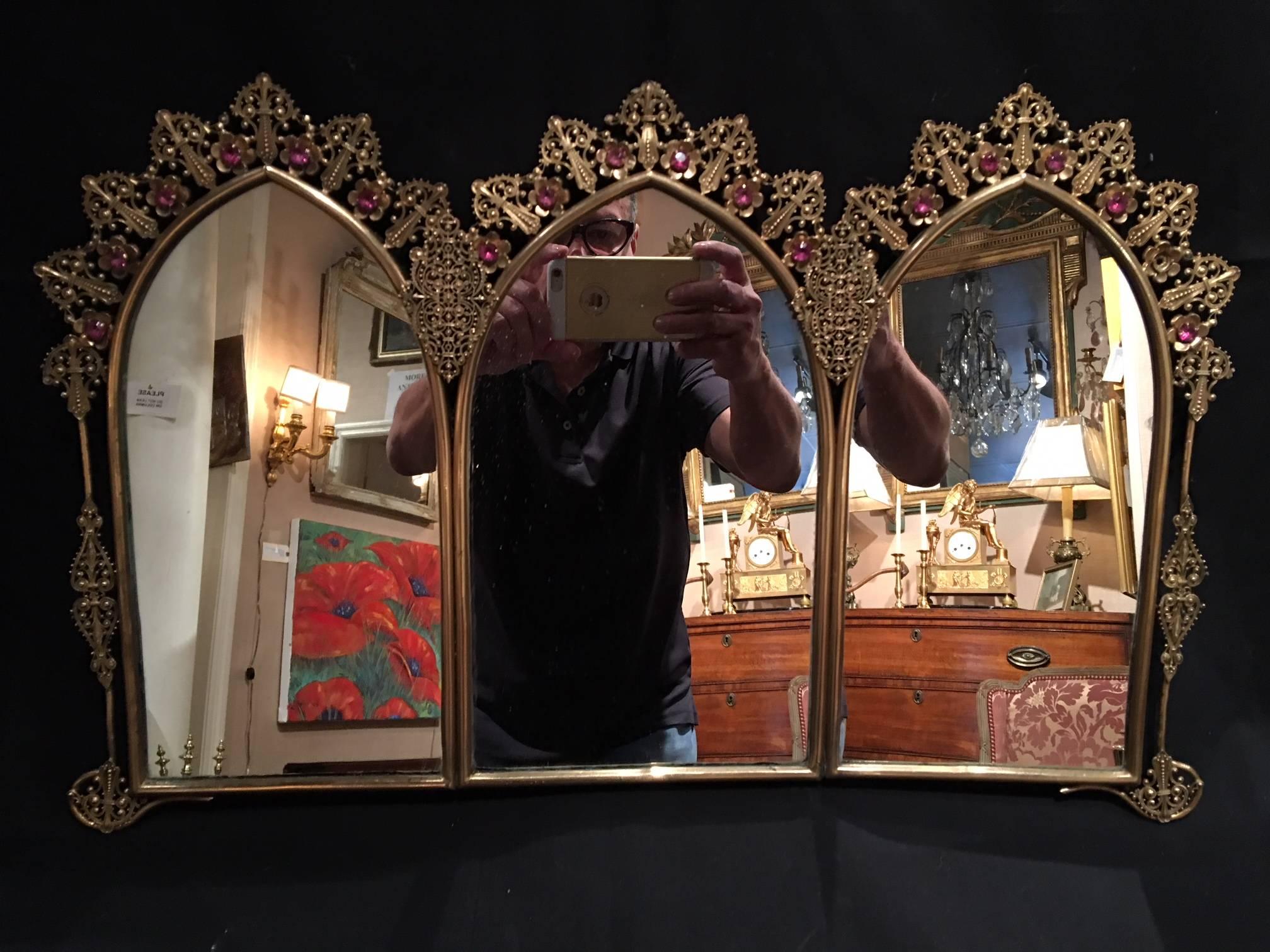 French polished brass triple mirror with decorative jewels, 19th century.