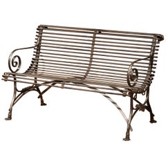 French Polished Iron Bench with Scrolled Arms and Hoof Feet Signed Sauveur Arras