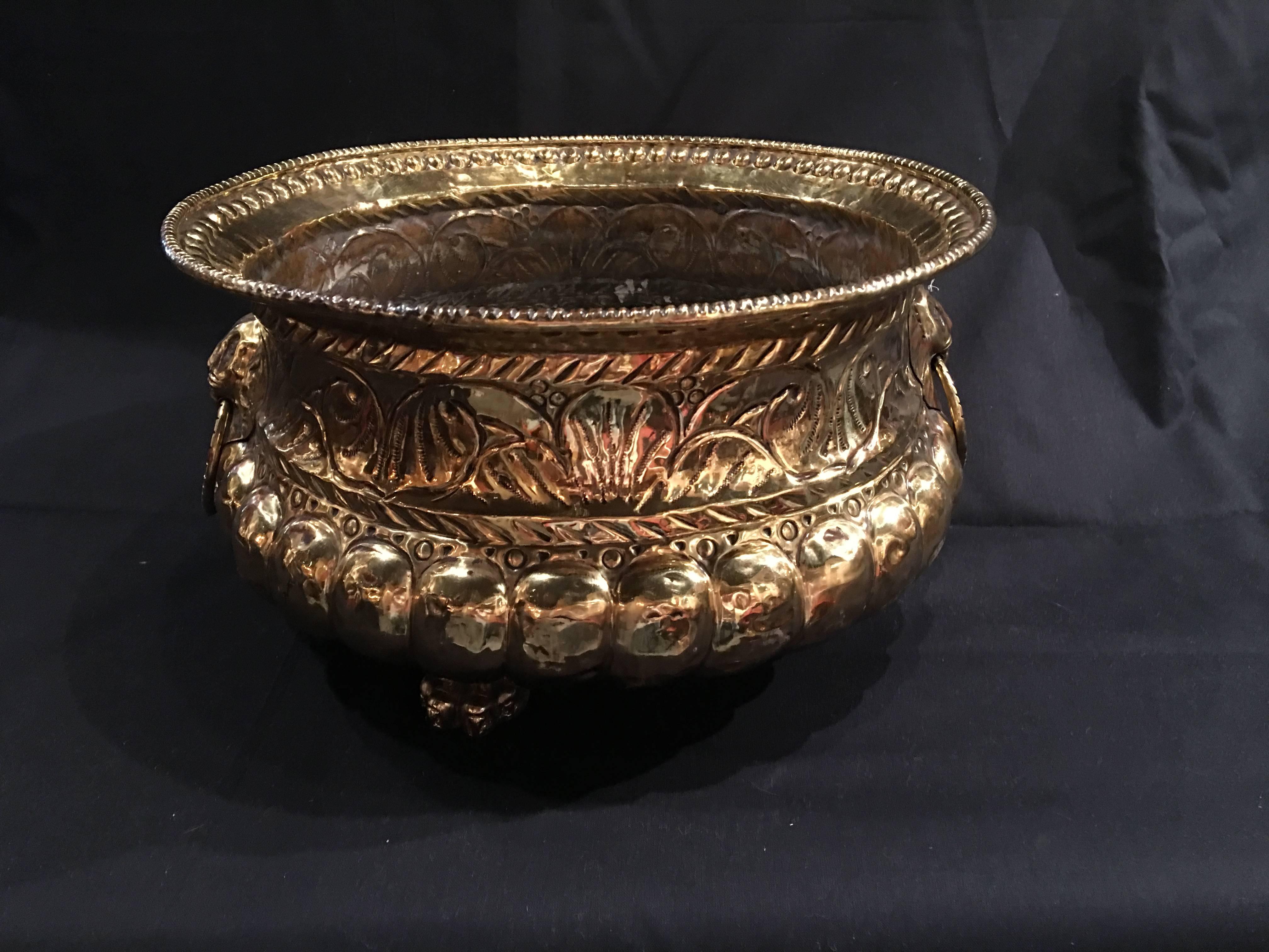 French polished brass round jardiniere or planter on feet, 19th century.