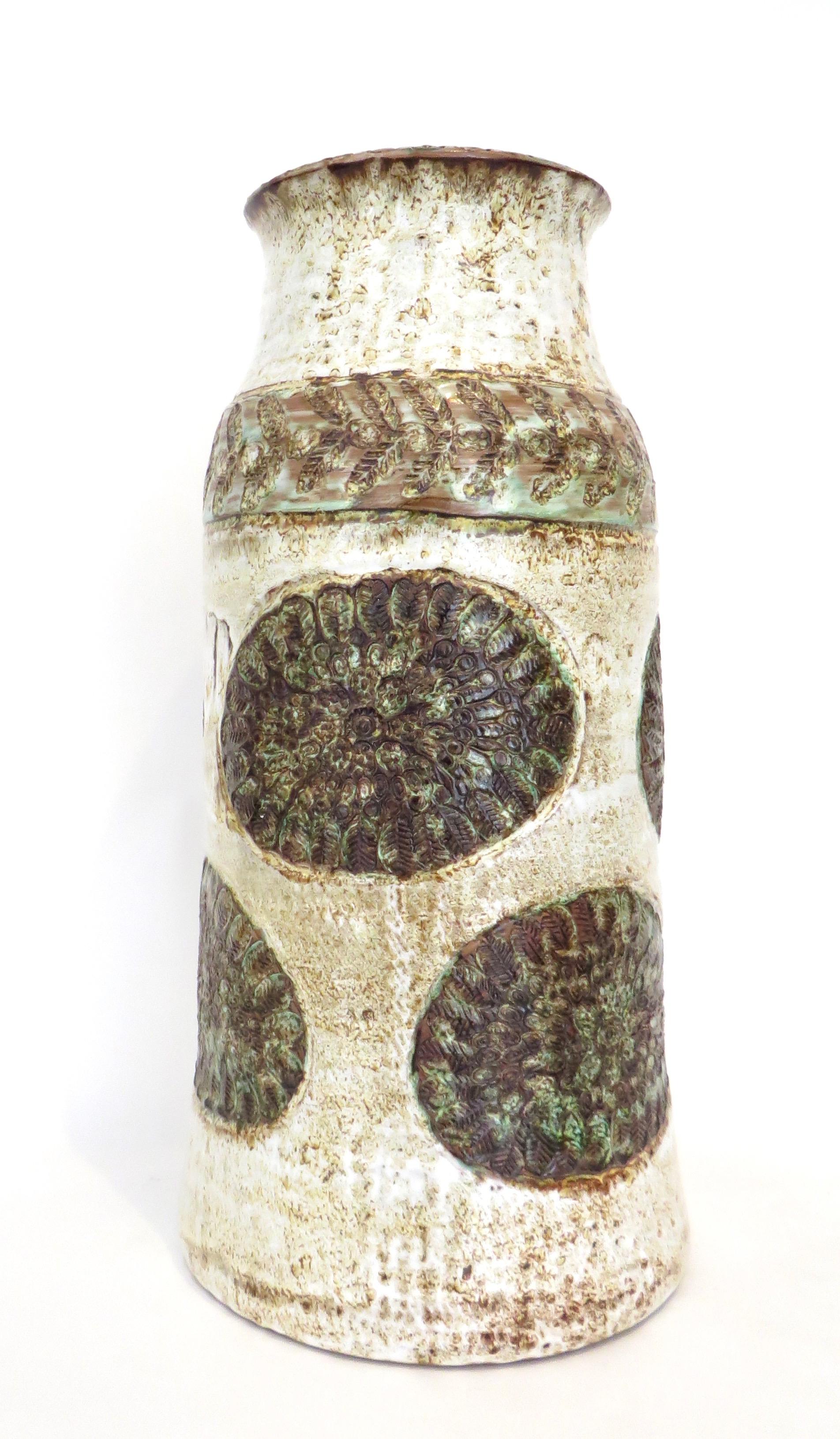 A tall ceramic vase from Vallauris France Signed Cardelle and Vallauris.
Carved, inised and colorfully decorated in creams, clue, green, brown on a cream background.
Excellent condition with no chips or cracks or restorations.
