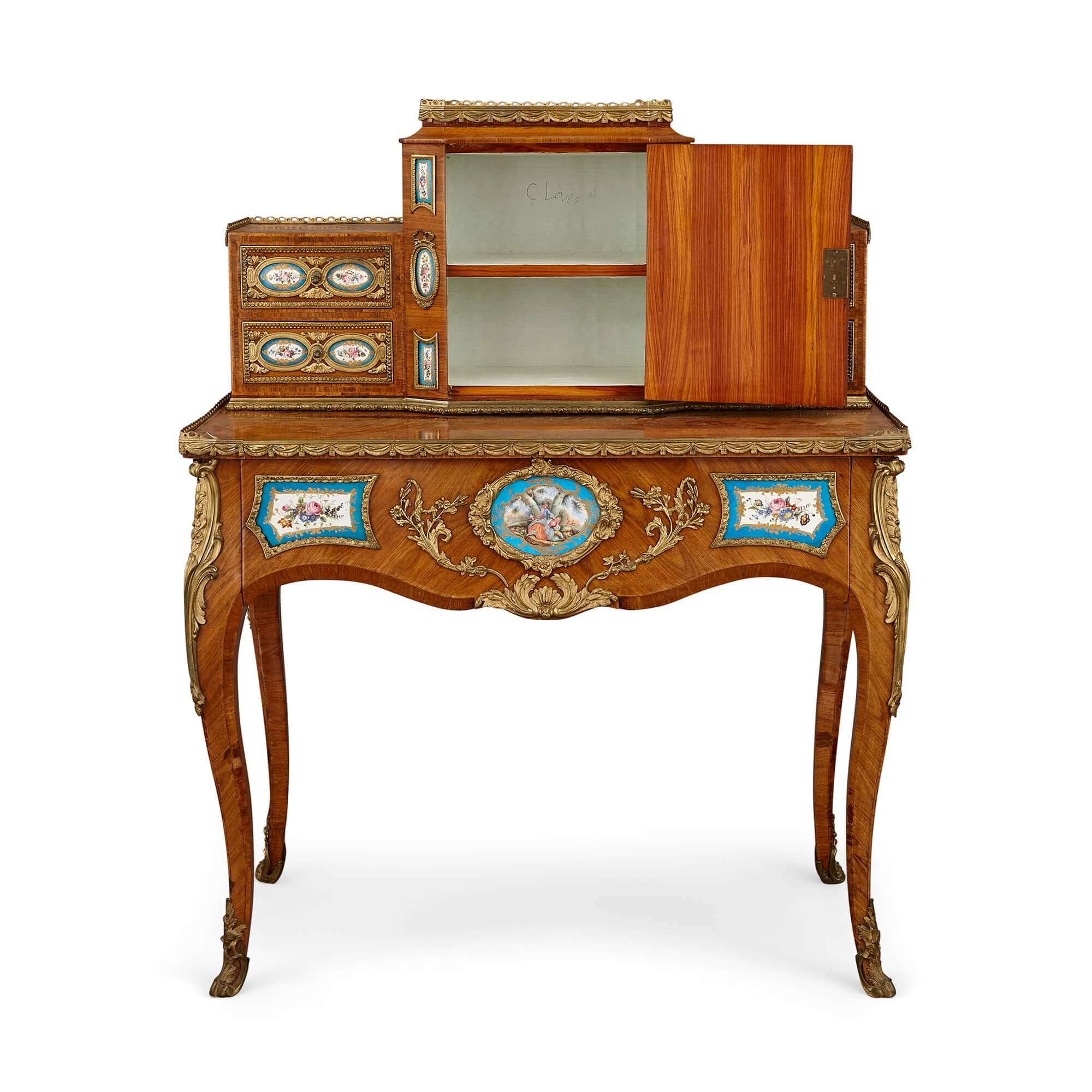 French porcelain and gilt bronze mounted writing desk
French, 19th Century 
Height 116cm, width 91cm, depth 51cm

This stunning bonheur du jour was made in France during the 19th century. A variation of a lady’s writing desk, this furniture type