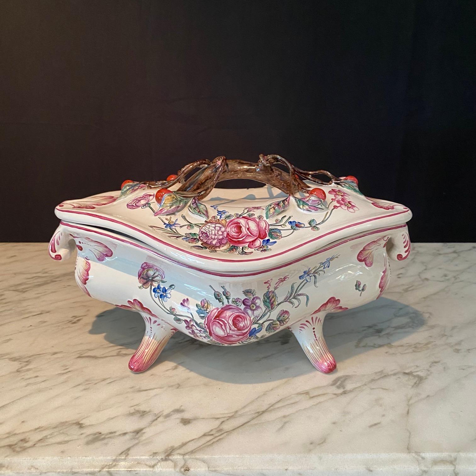 A lovely, highly detailed hand painted French Barbotine Majolica Faience soup tureen, with handles, feet and nicely sculpted cherry tree decorated cover.  The painted decoration on the sides and on the large platter include detailed flowers,