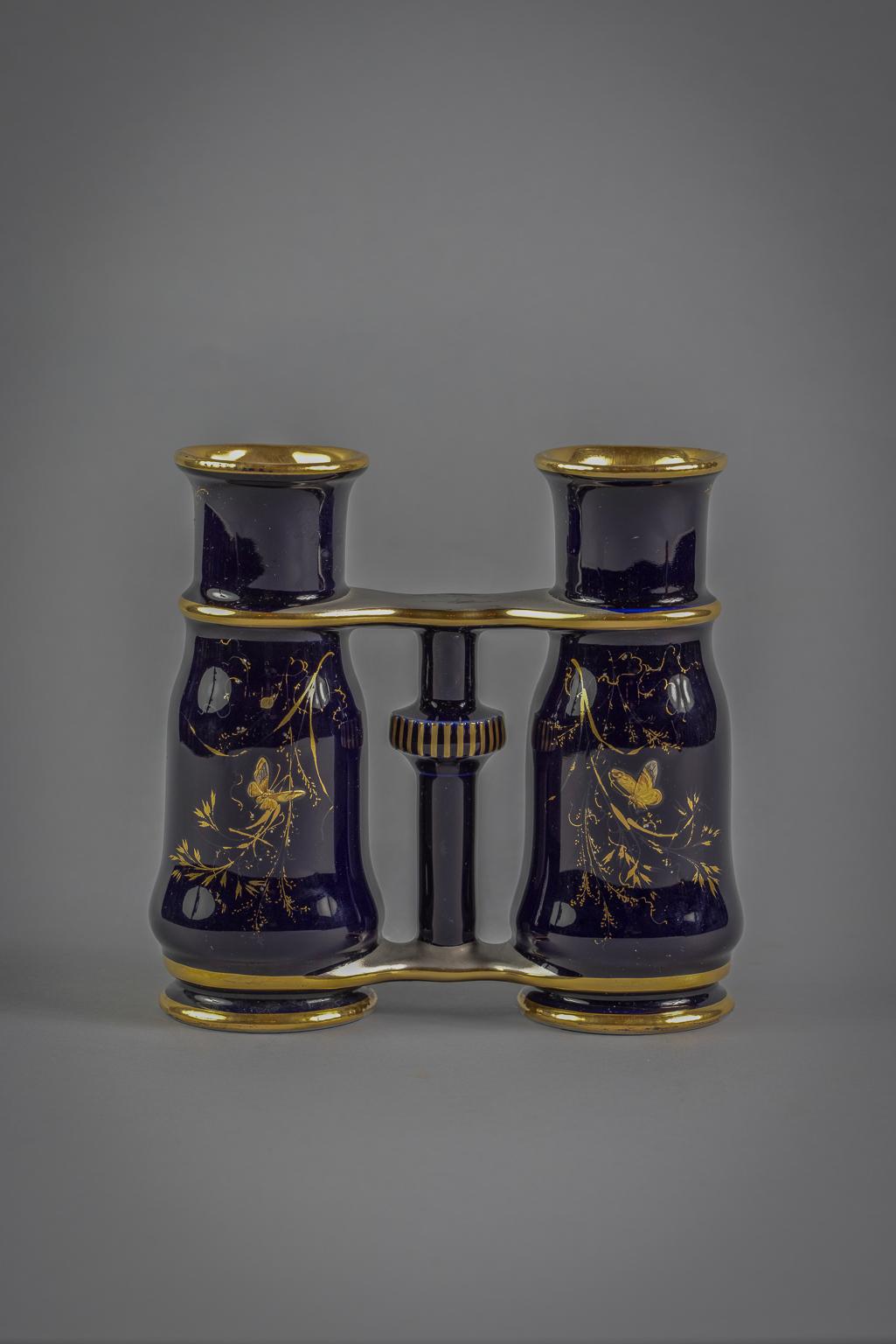 On a dark cobalt ground decorated in gilt and platinum with bees and butterflies amongst foliage. Incised with JP mark.