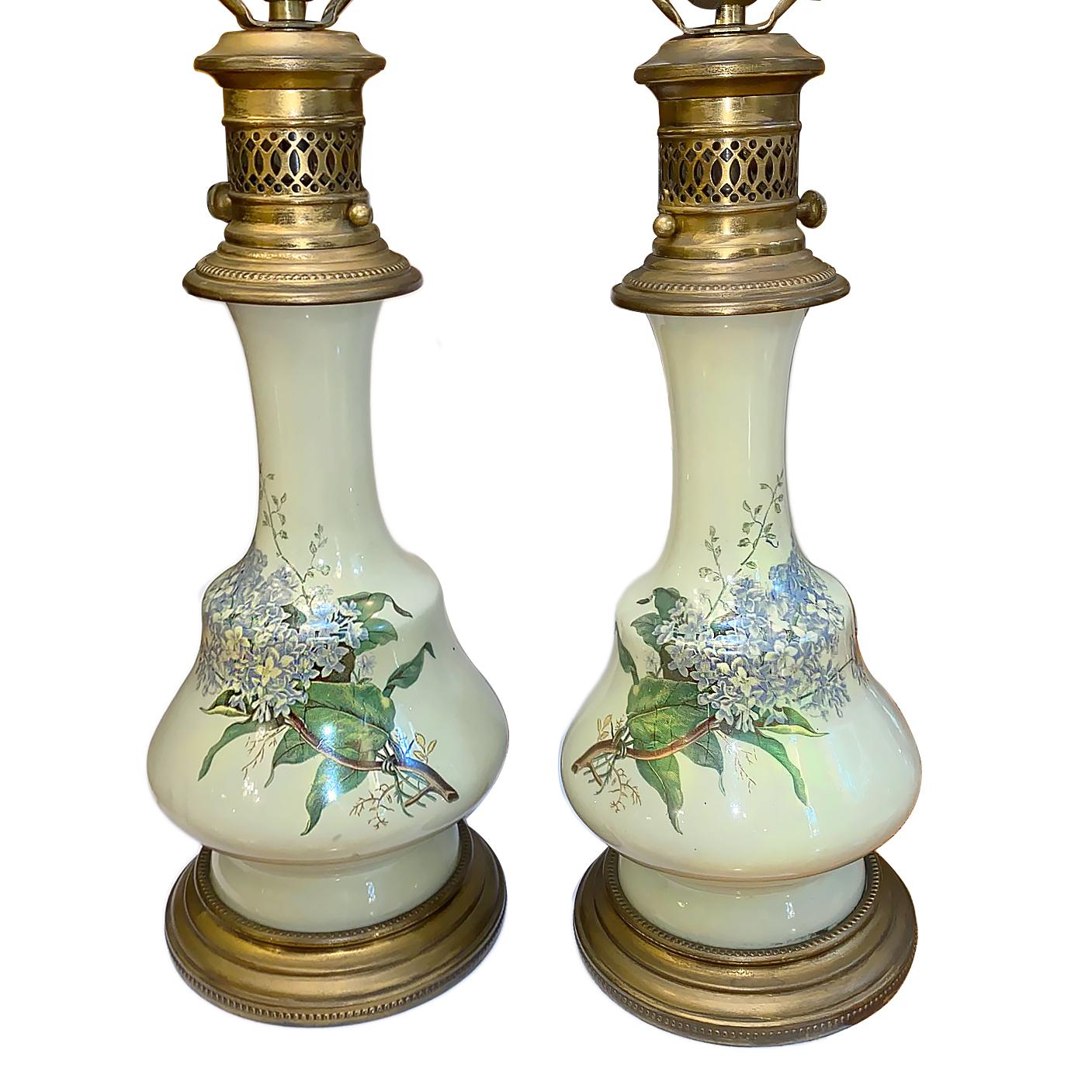 Pair of circa 1920's French celadon-hued table lamps with floral motif.

Measurements:
Height of body: 17