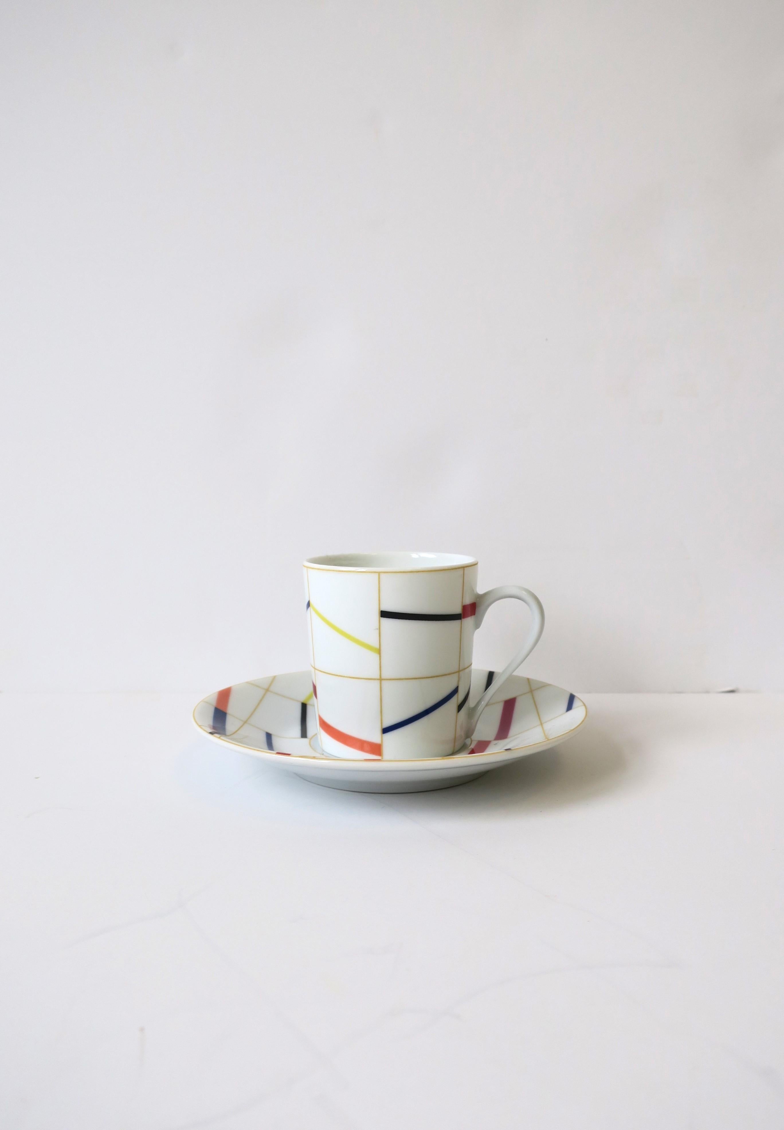 A beautiful French porcelain espresso coffee or tea demitasse cup and saucer with colorful abstract design, circa late-20th century, France. Marked on bottom as shown. 

French black glass ice bucket shown available separately. 


