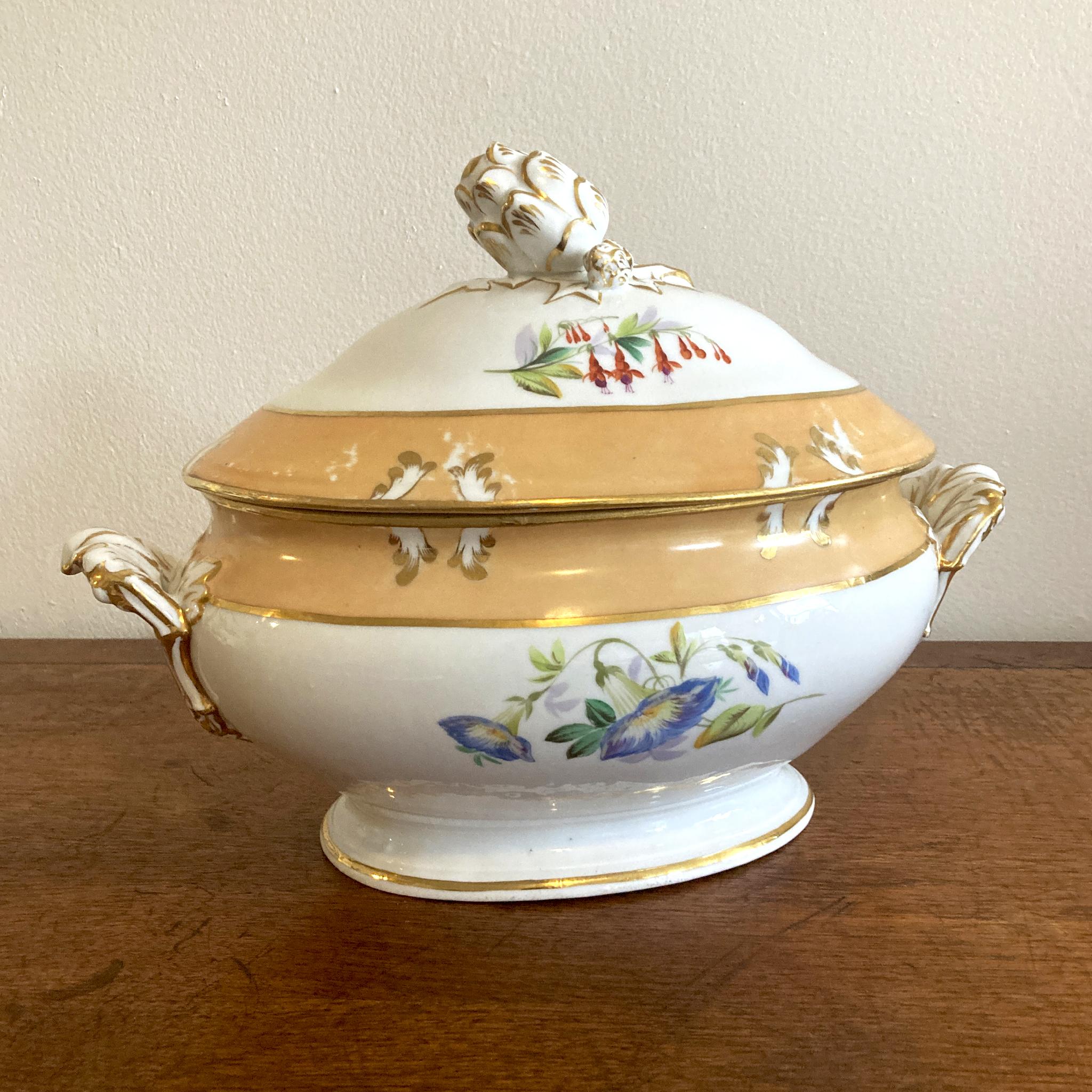 19th Century Vieux Paris Hand Painted Soup Tureen of oval form, with two faux bolted handles to the sides; and domed lid with acorn form knob. The handles and knob resting in and on moulded leaves, picked out with gilding, and the detail to the