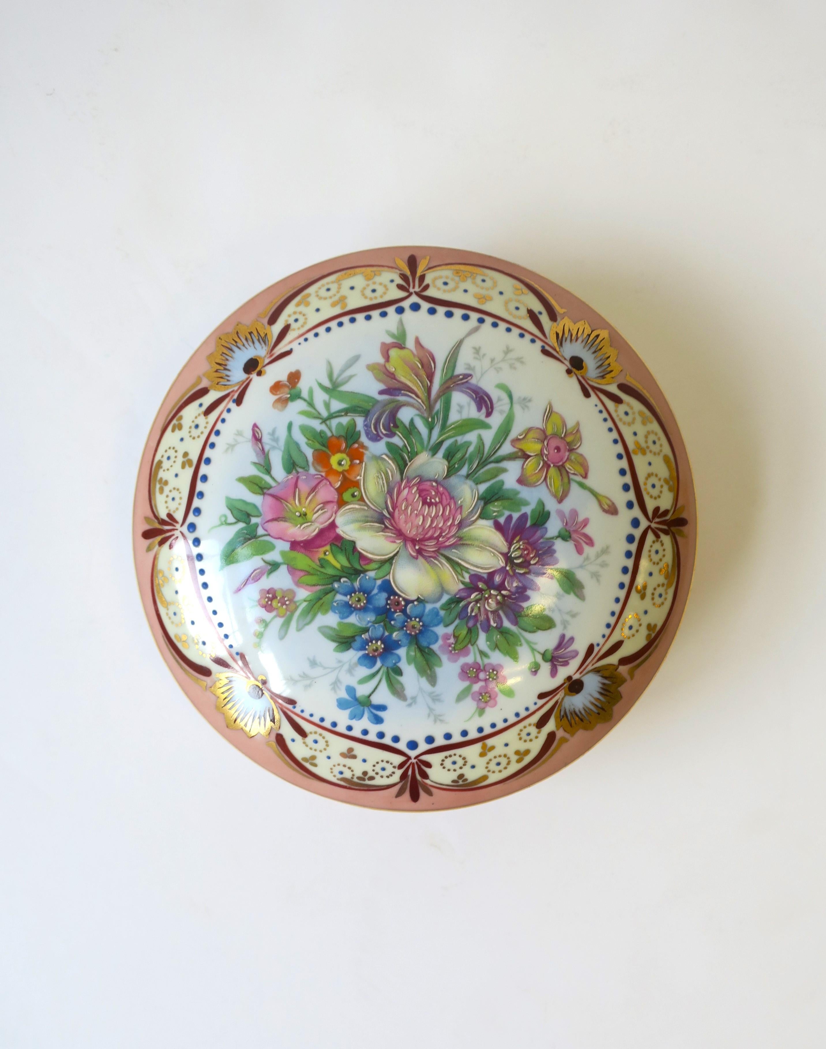 A French porcelain jewelry box with flower and leaf design and touch of gold detail, circa mid-20th century, France. A great piece for any vanity, dressing area, bathroom, closet, etc. Marked 'France' on underside as shown. Box is a nice size.
