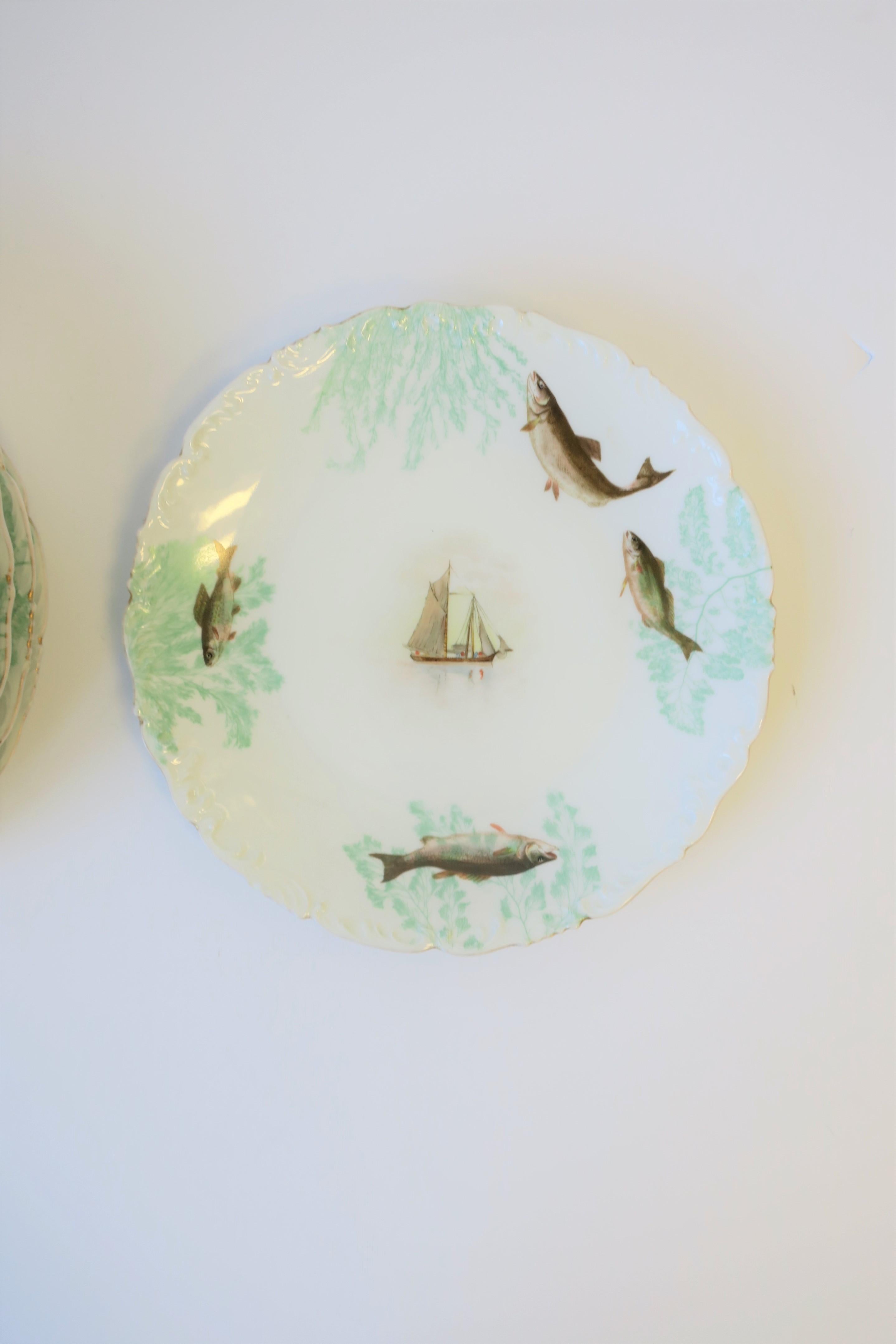 French Limoges Porcelain Dinner Plates with Rustic Fish & Boat Design, Set of 8 For Sale 1