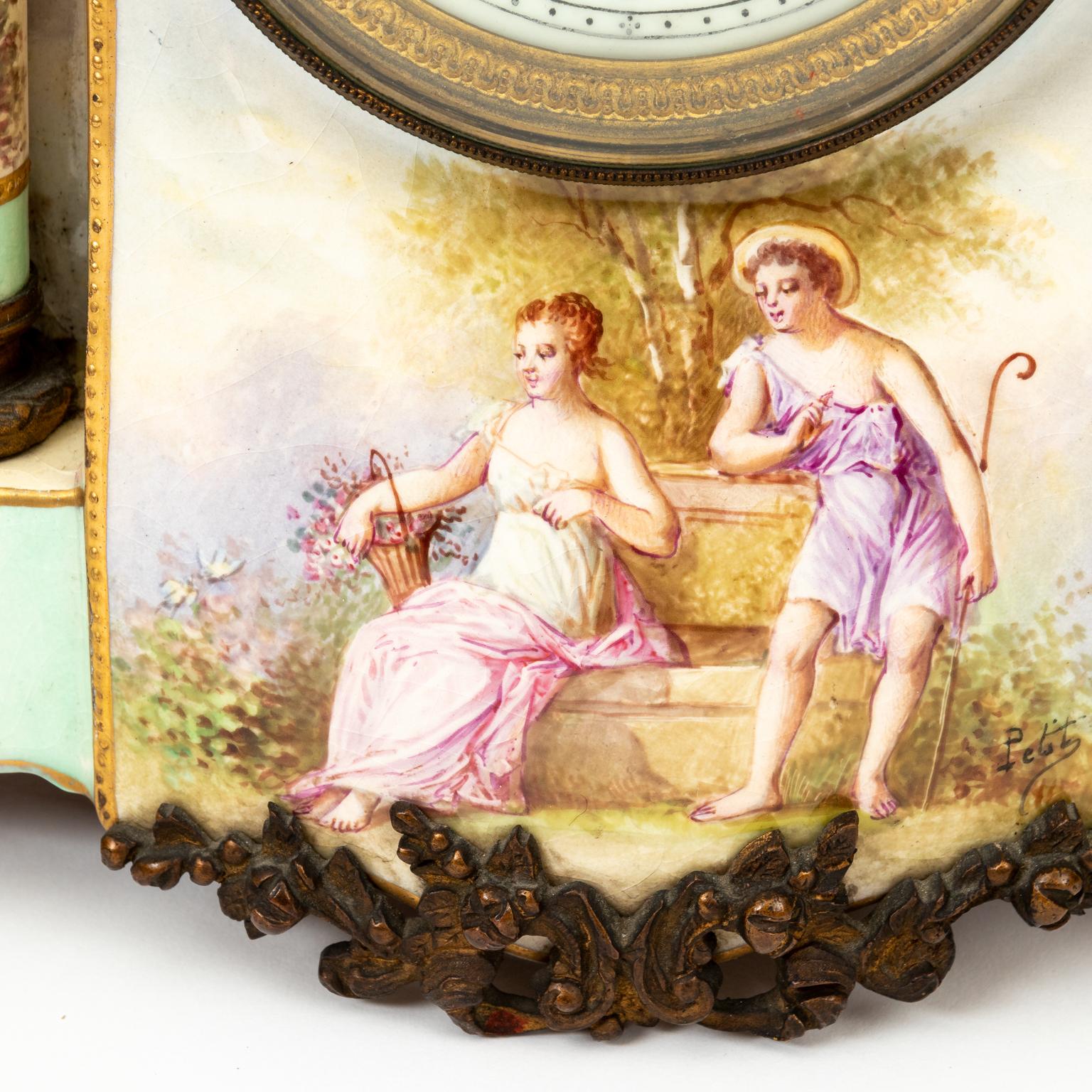Hand painted porcelain French mantel clock signed by artists, circa 1880s. The piece is decorated and painted with floral details throughout along with the depiction of a two figures on the front. It comes with a key and pendulum. Please note of
