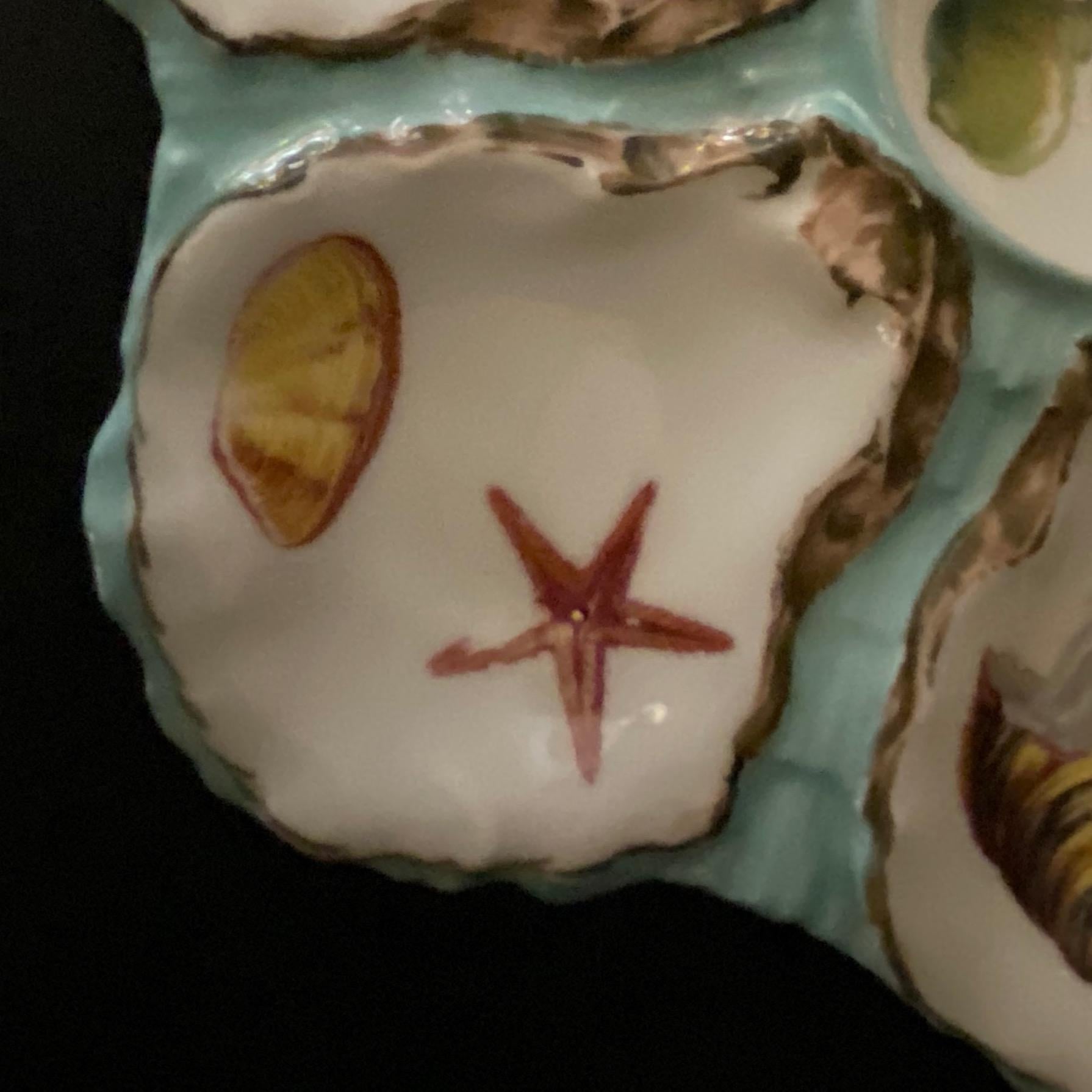 Collector piece, mid-19th century famous Haviland Limoges Porcelain Oyster Plate, with six oyster cradle. The relief of each oyster shells is with refined hand painted details which gives an optical illusion, while the inside of the oysters is