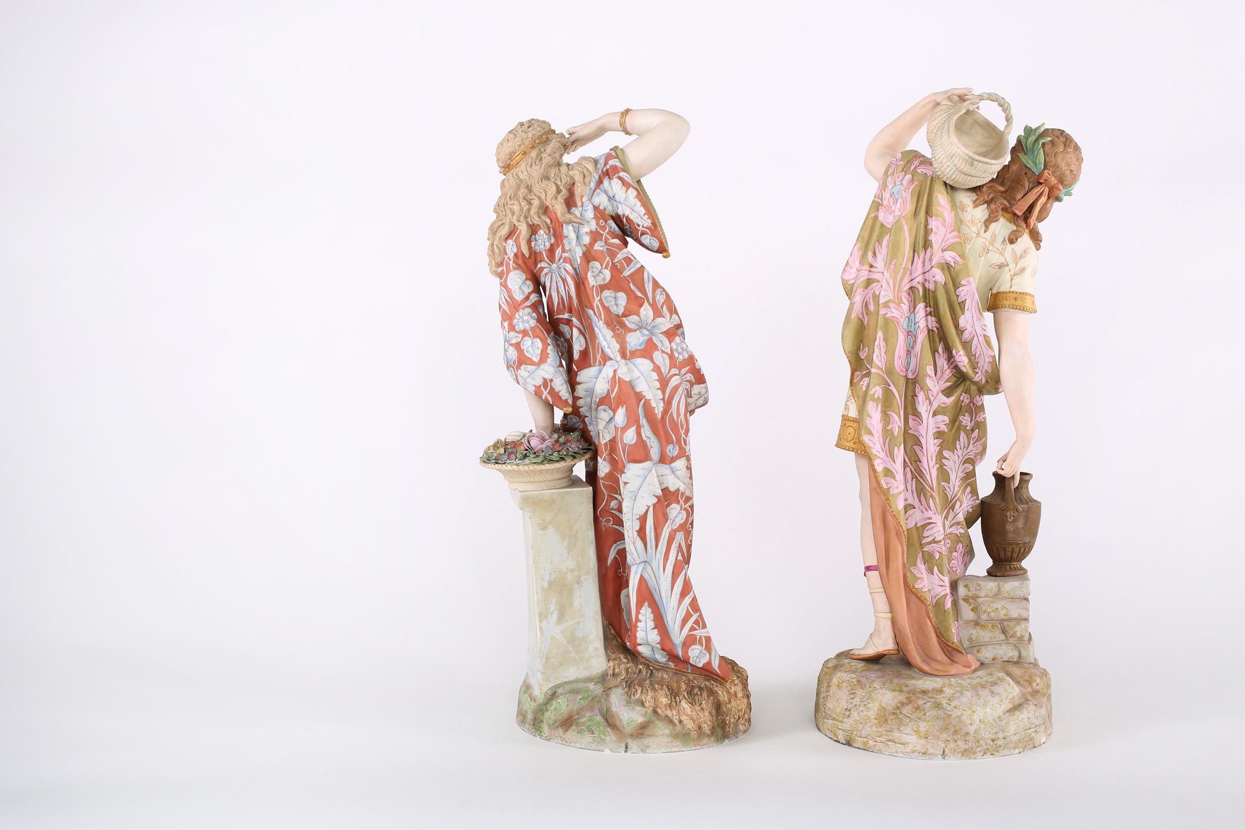 French pair of large and impressively decorated porcelain centerpiece figures. Each one is in great antique condition with appropriate wear consistent with age / use. Both Repaired on the base. Each decorative piece is about 24.5 inches high x 9