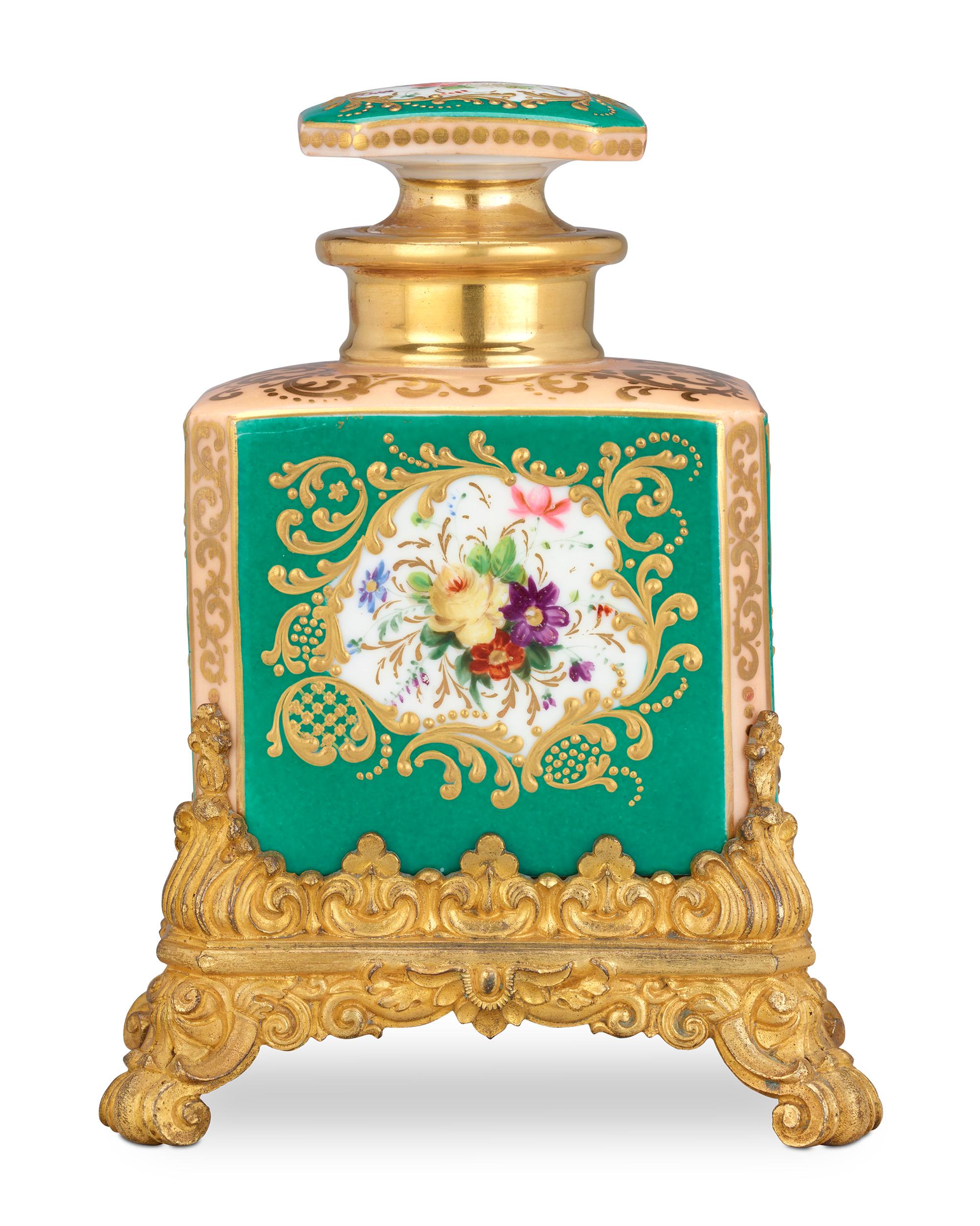 A bird in flight adorns this charming perfume bottle attributed to famed French porcelain maker Jacob Petit. It is exemplary of the opulent artistry for which Petit is renowned, from its vibrant green ground to its Rococo-style ormolu base.

Circa