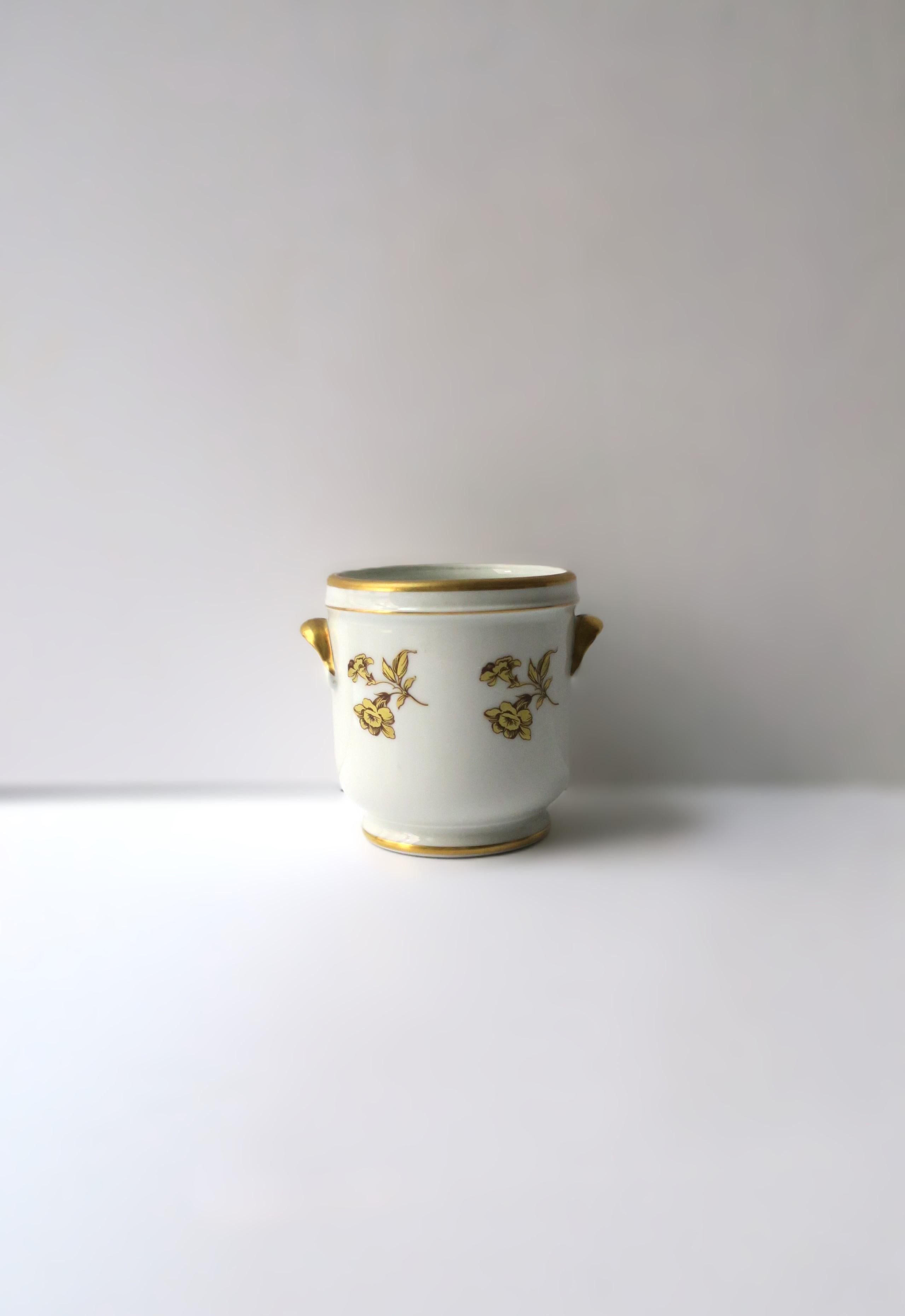 A beautiful French white porcelain plant or flower planter cachepot jardinière, with gold detail, circa mid to late-20th century, France. Piece is from 200-year-old master porcelain maker, Pillivuyt, France. Cachepot has two handles with gold