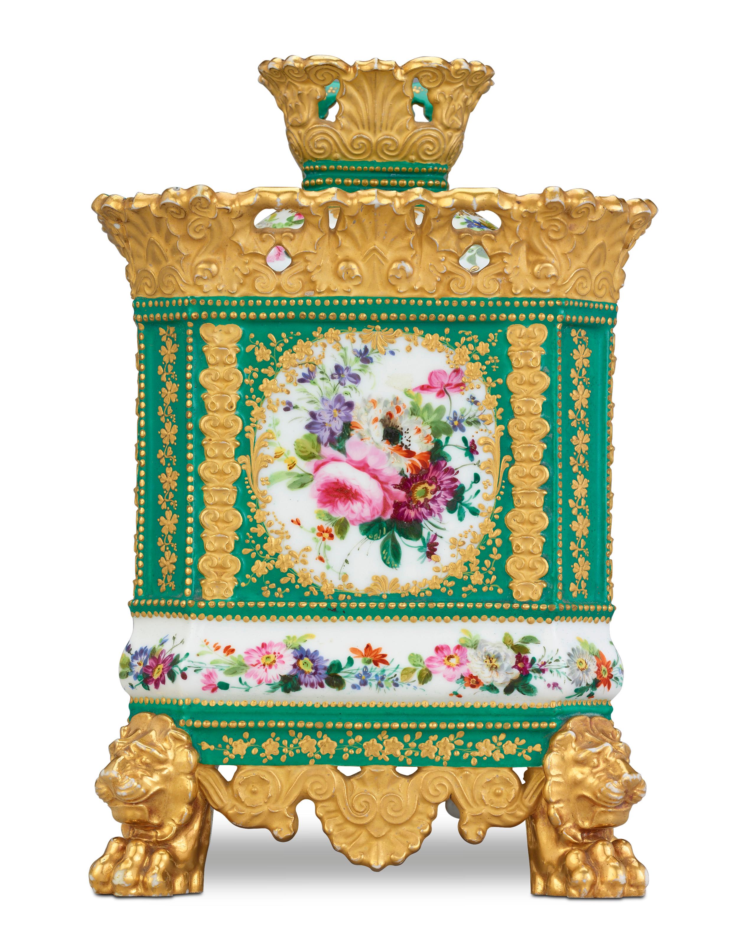 Designed to diffuse the vapors of potpourri throughout a room, this porcelain potpourri was crafted by Jacob Petit, one of the finest French porcelain artists of the 19th century. Adorned by a floral still life on a green ground, it is further