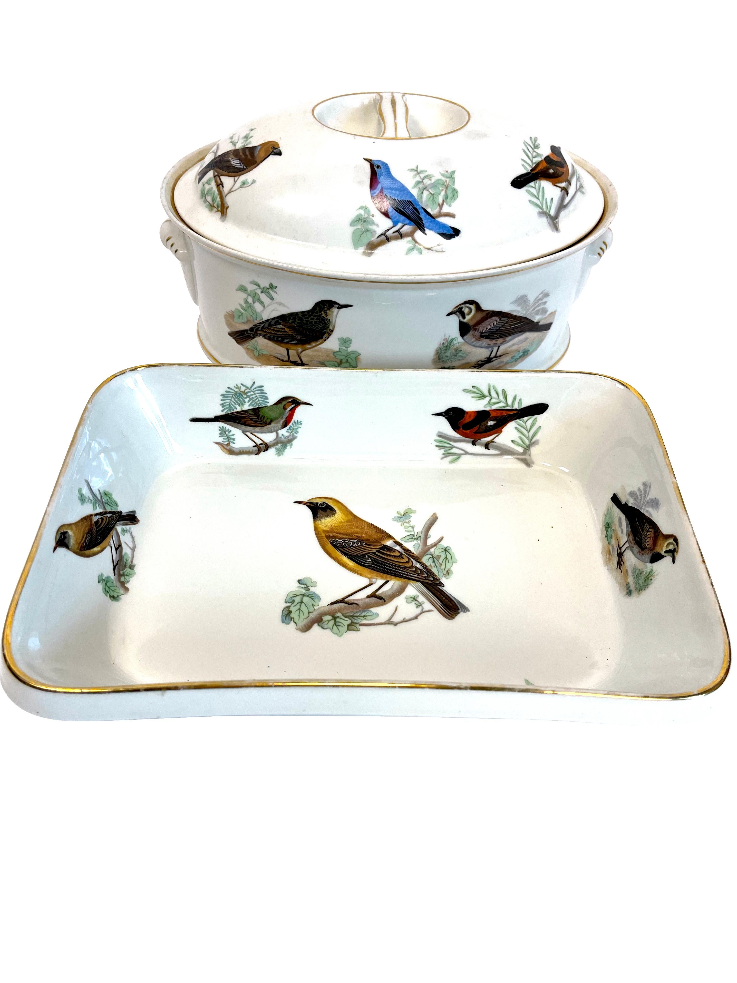 French porcelain serving pieces group of four with bird decoration- oval casserole, petit round casserole, and two rectangular baking dishes. All ovenproof with various bird designs.