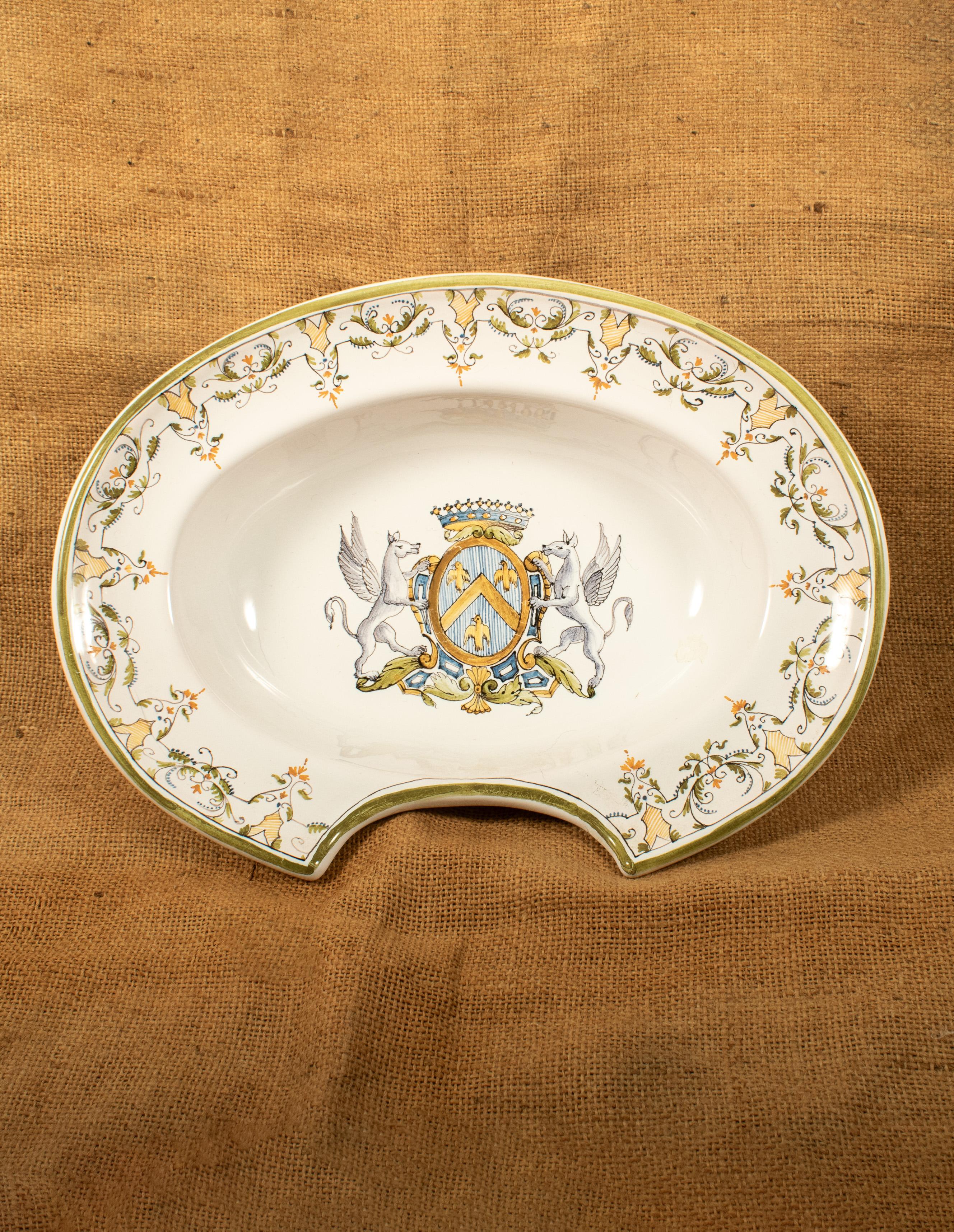 French Porcelain Shaving Dish, “Italien à Moustiers”, Early 20th Century

A beautifully hand-painted French porcelain shaving dish or barber’s bowl in the Italianate Moustiers style, dating to the early 20th century. The piece features a heraldic