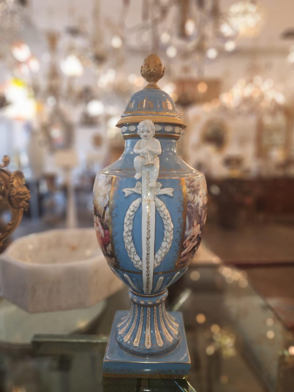 Pair of Stunning 19th Century French porcelain urns. In perfect condition. In the Baroque style. Perfect for entry way accents.