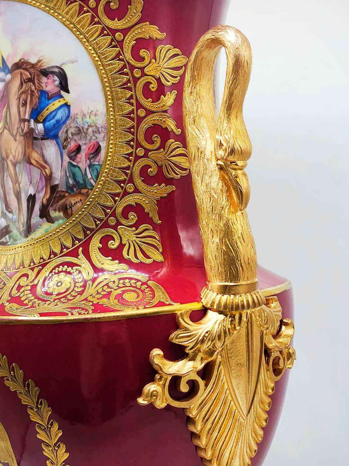 French porcelain vase Napoleonic Empire 19th century

Extravagant pink French porcelain vase with flamingo handles, base with flamingo leg design and paintings on both fronts, signed A.Querin.
The vase has a restoration in the mouth done by