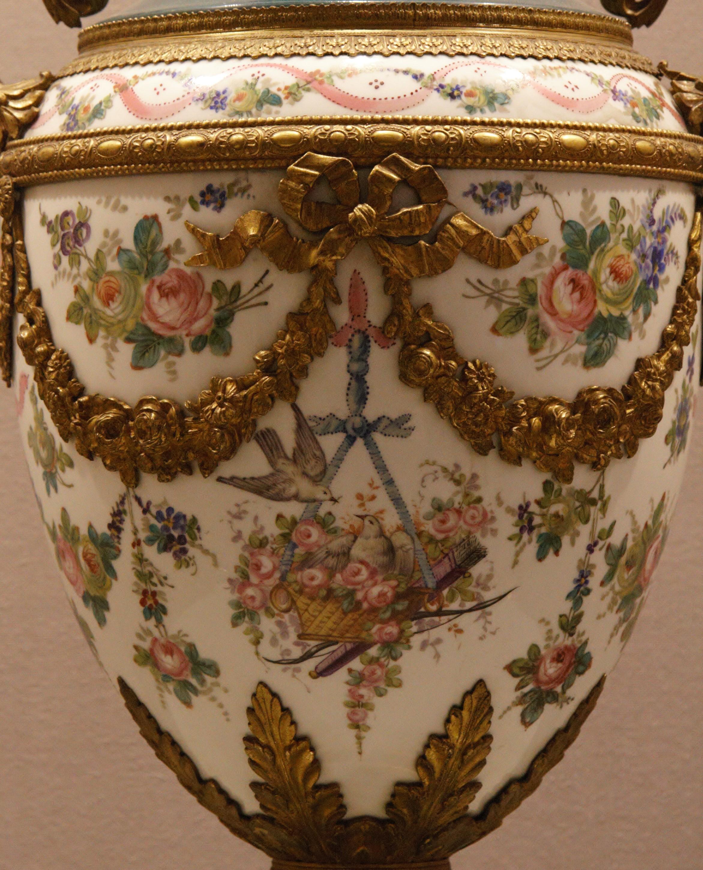 A vase in porcelain finely painted with flowers and turtle doves, garlands in bronze gilt, Louis XVI Style, circa 1890.