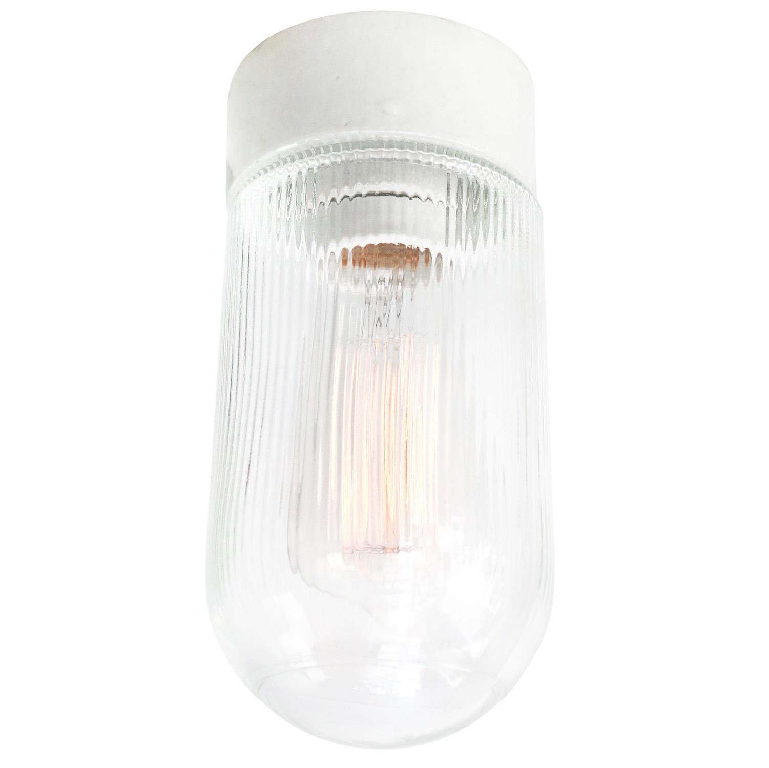 Industrial wall / ceiling / flush mount lamp. White porcelain. Clear glass.

2 conductors, no ground.
Measures: Diameter foot 10 cm
Suitable for 110 volt USA
new wiring is CE certified (220 volt)  or UL Listed (110 volt) 

Weight: 0.90 kg / 2