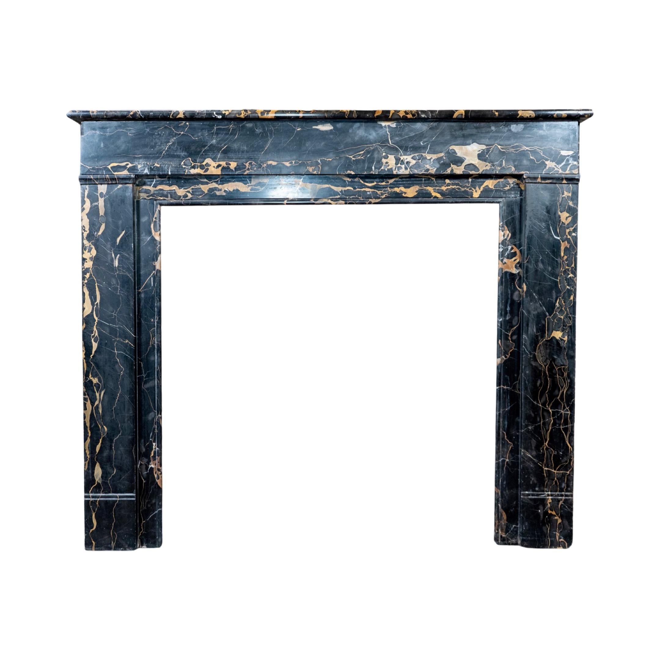 This elegant French Portoro Marble Mantel is a luxurious piece of history. Crafted with 1890 French marble, the Louis XVI style mantel exudes prestige and sophistication. Its timeless design will add sophistication and class to any room.