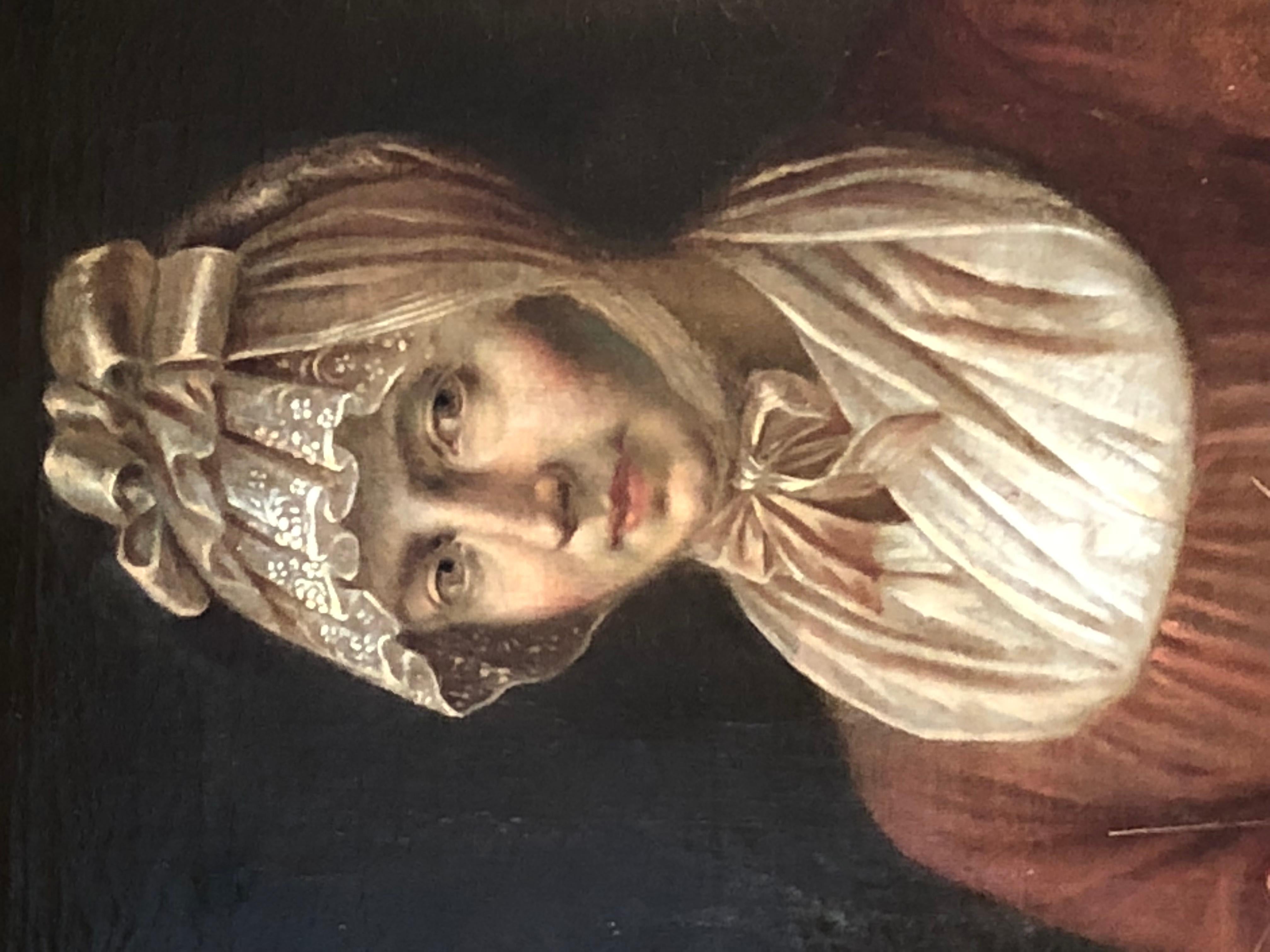 A French oil-on-canvas portrait of a woman in Period clothing sitting in a chair, knitting. Signed illegibly lower right, the portrait is in a giltwood Louis XVI style frame.