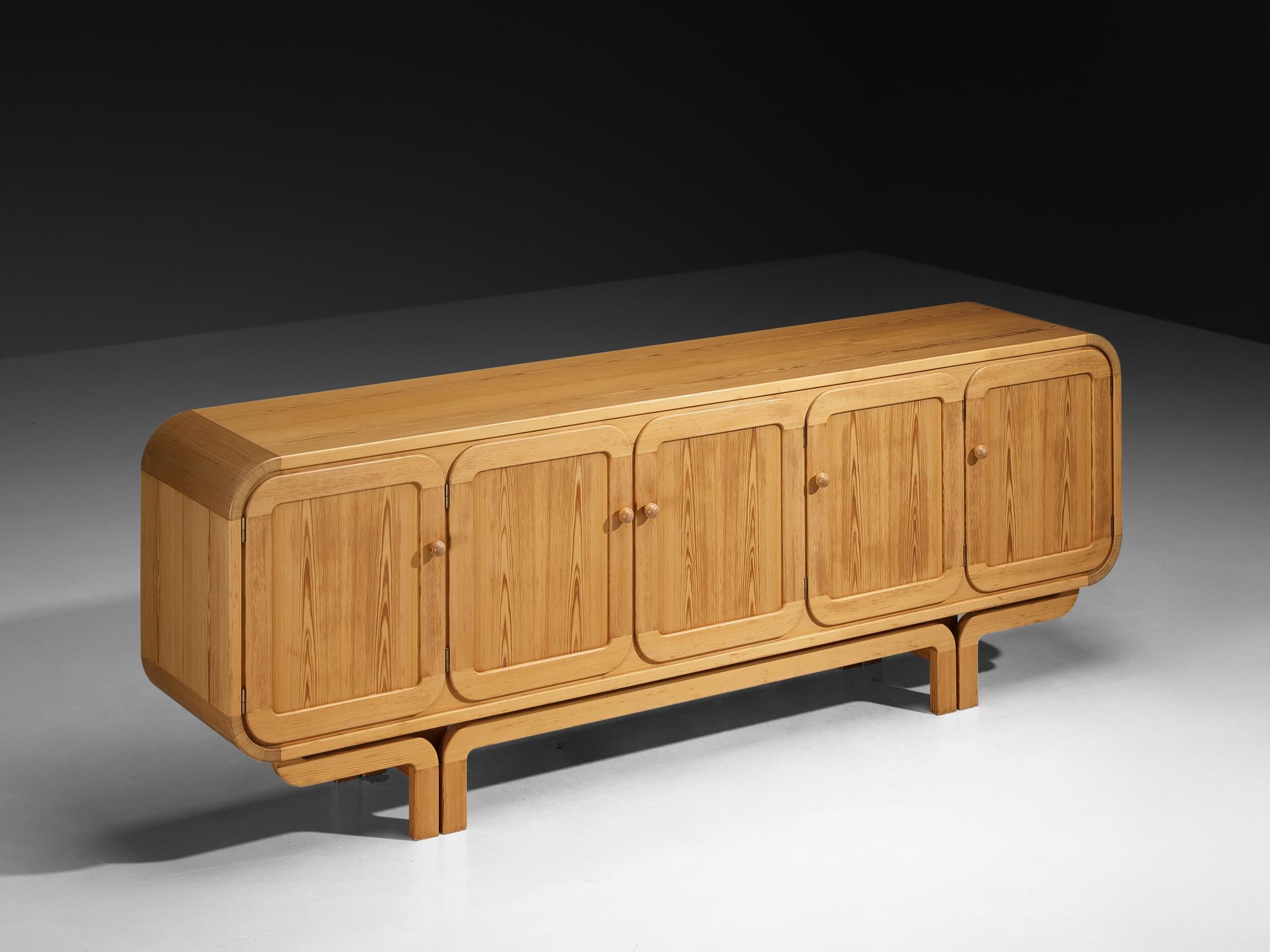 Sideboard, pine, France, 1980s

This striking sideboard is a strong example of popular design with a playful, futuristic twist. Made in France and crafted from pinewood, the piece immediately catches the eye with its rounded shapes and flowing