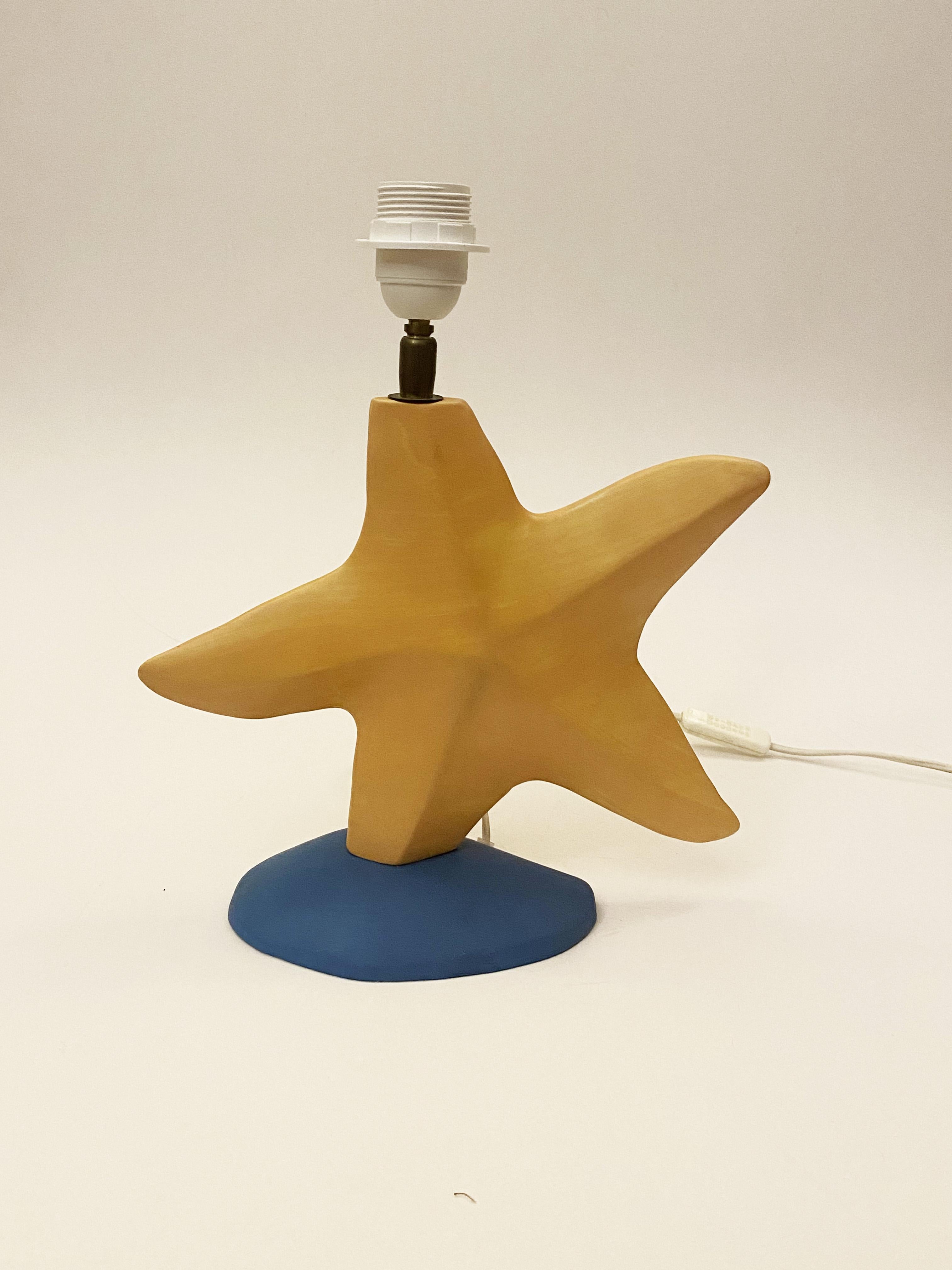 French Postmodern Star Ceramic Lamp by François Chatain, 1980s
Very good condition.
34 cm height without the lampshade, 44 cm height with the lampshade.
