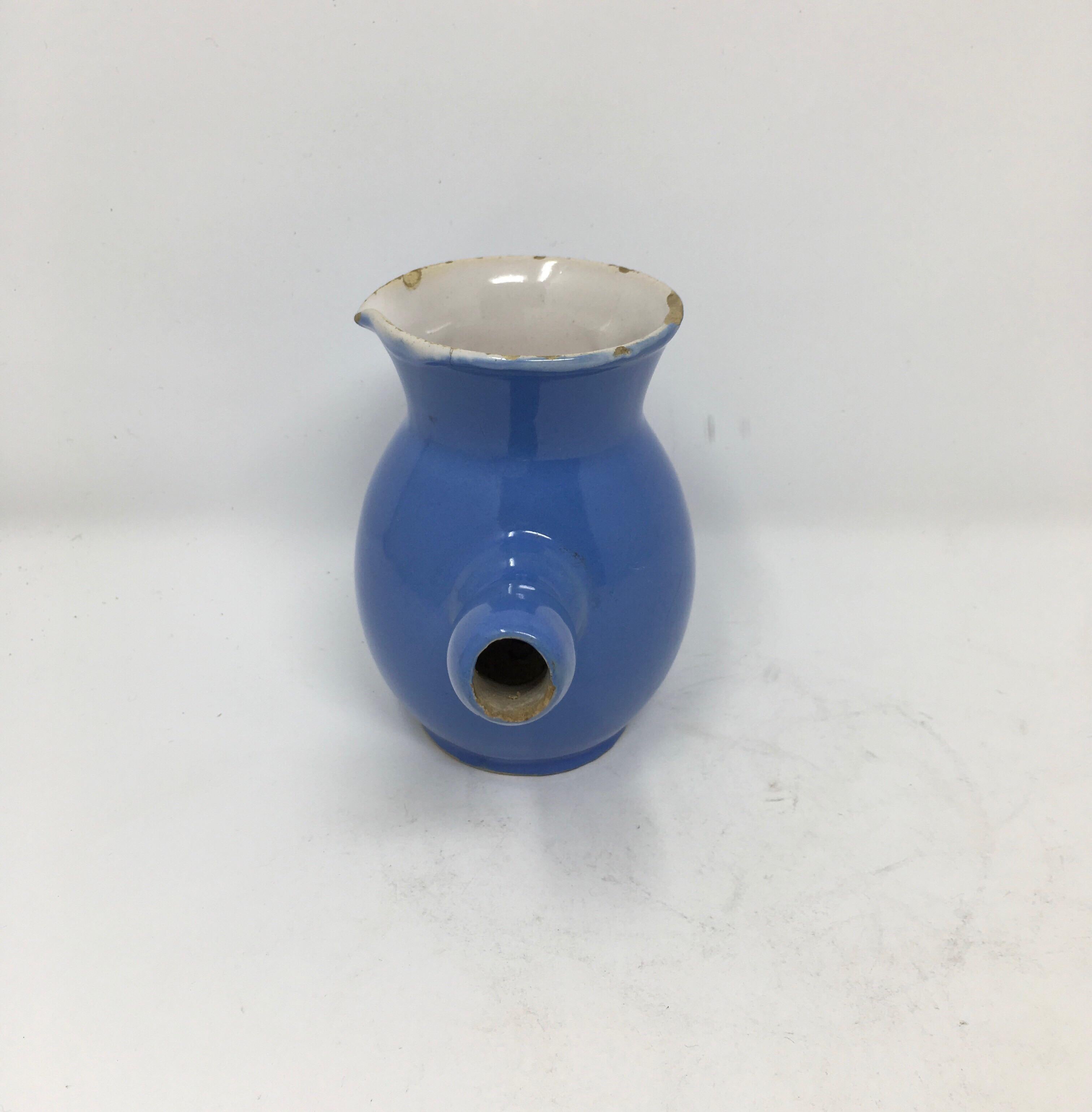 Found in the South of France, this hot chocolate pot was popularized in France in the 1800s. It features a pottery construction that retains heat for one hot serving after another. Covered in a blue glaze, from the South West of France, it is