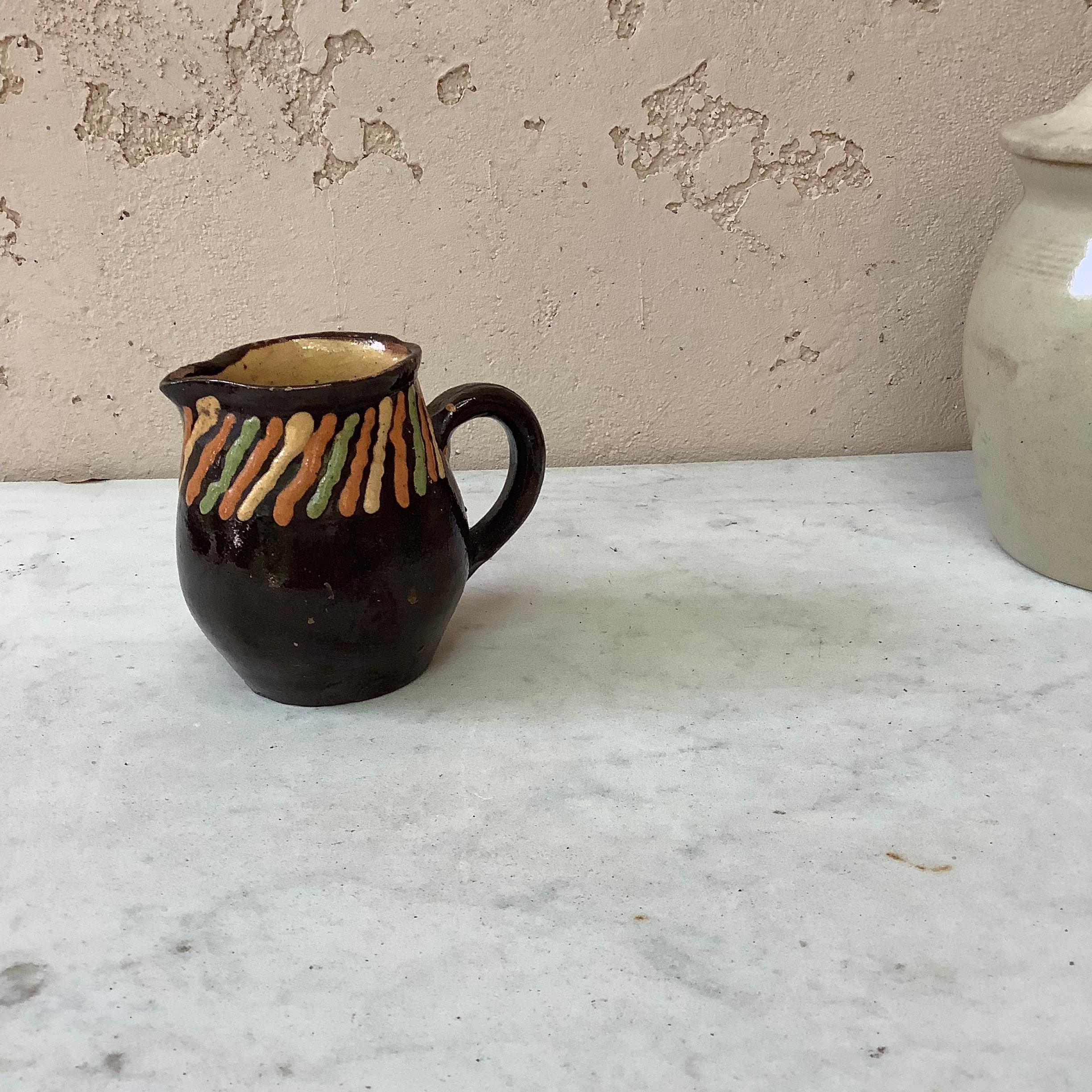striped ceramic pitcher