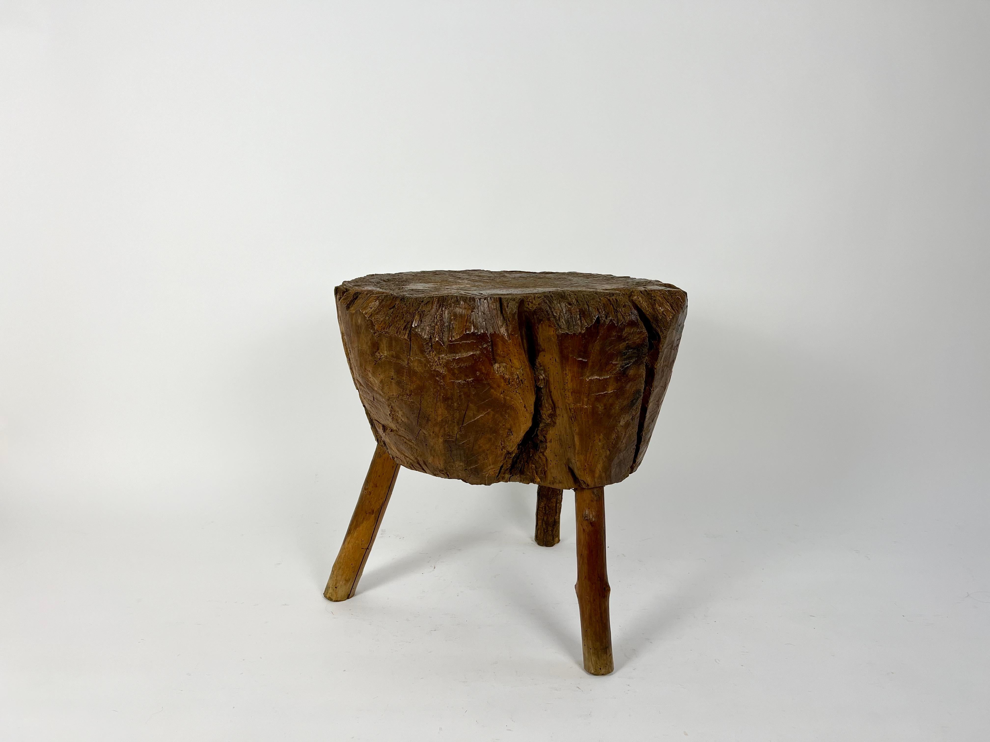 Chestnut French primitive brutalist chopping block side table, early 20th century For Sale