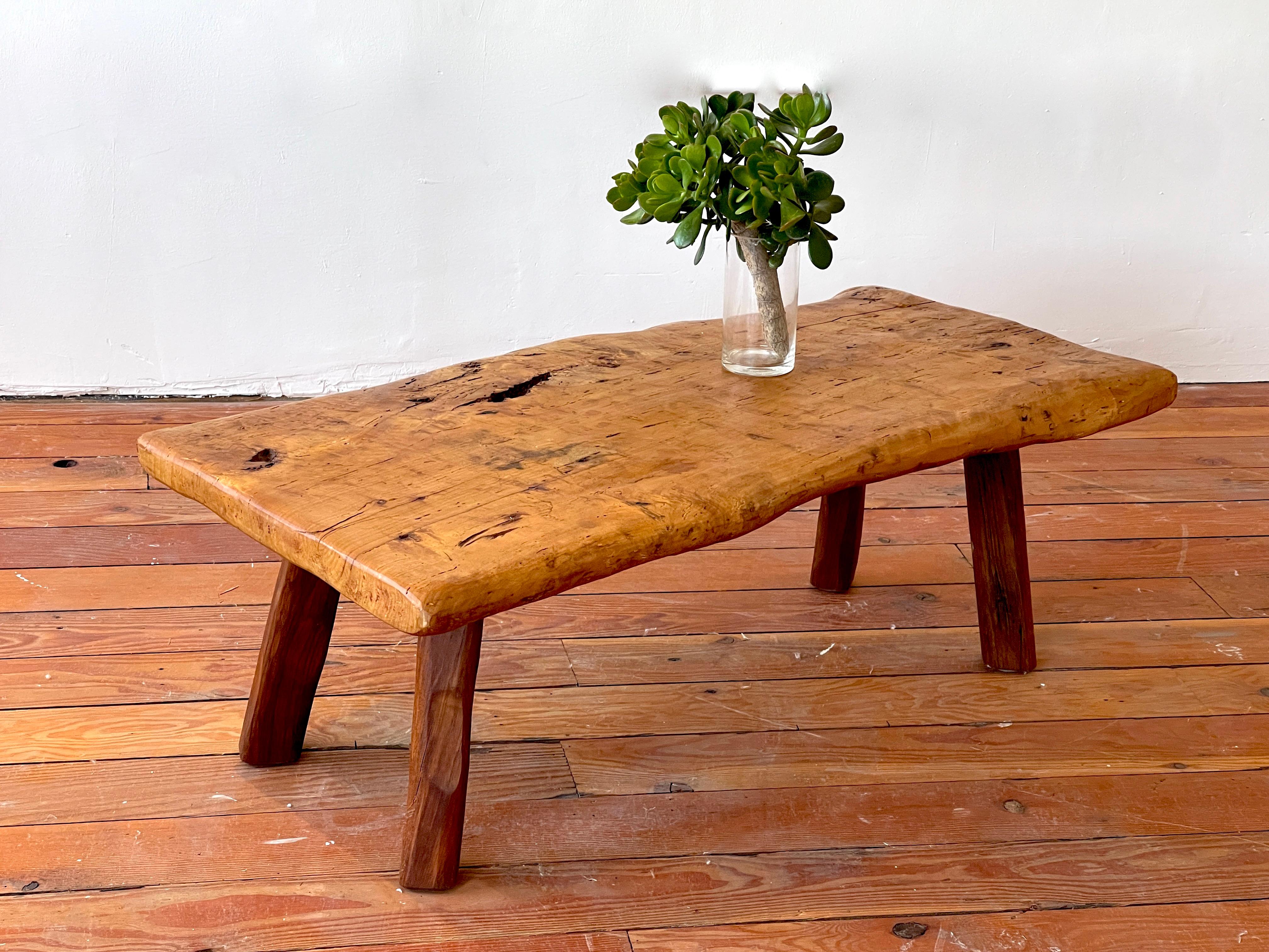 French brutalist coffee table in elm wood.
Natural form with thick wood and carved legs.
 