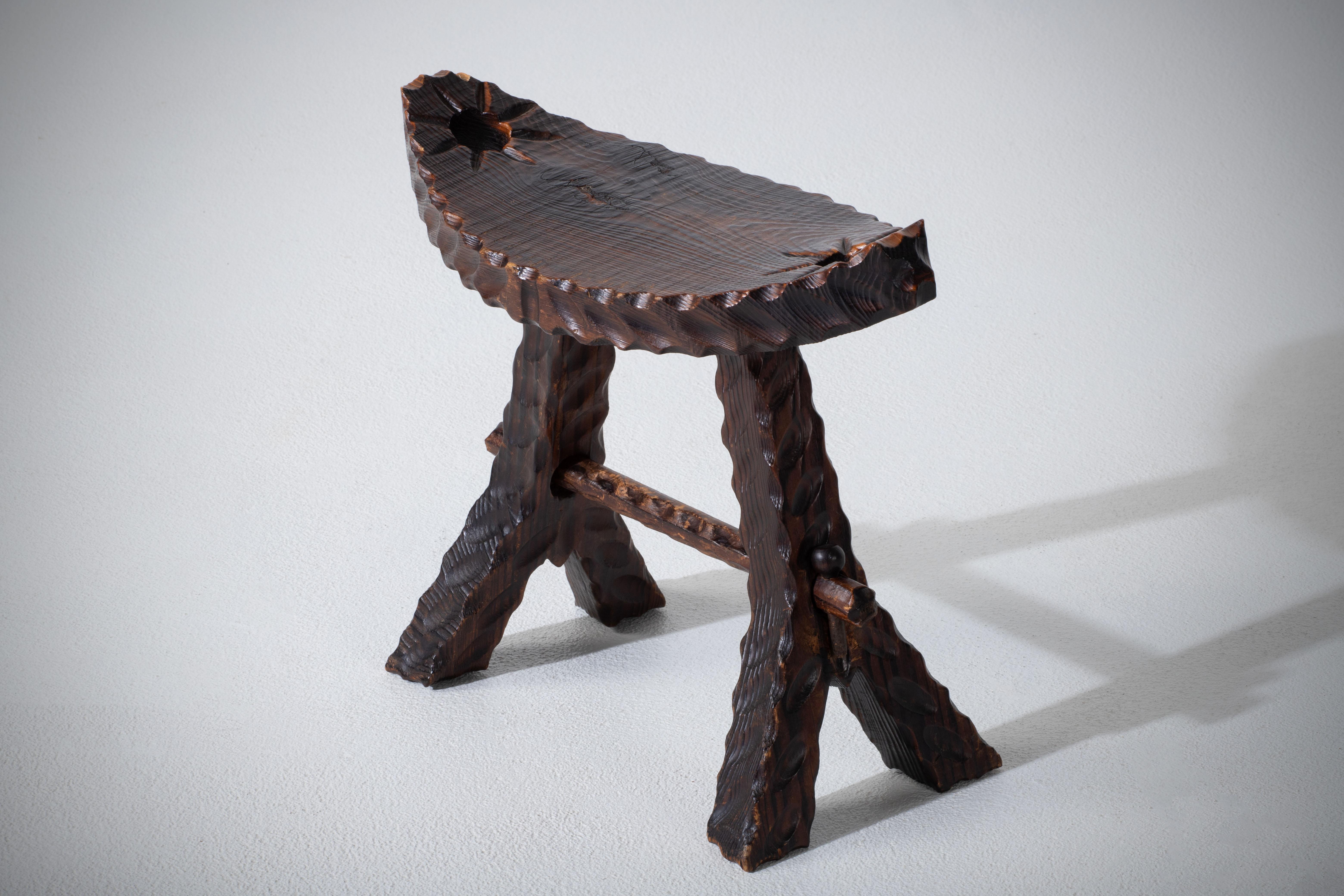 Fantastic Primitive stool from Ouest Africa in the style of Jean Touret. 
Made in the 1950s, the gauge work enhances the rustical style. 
Good vintage condition.