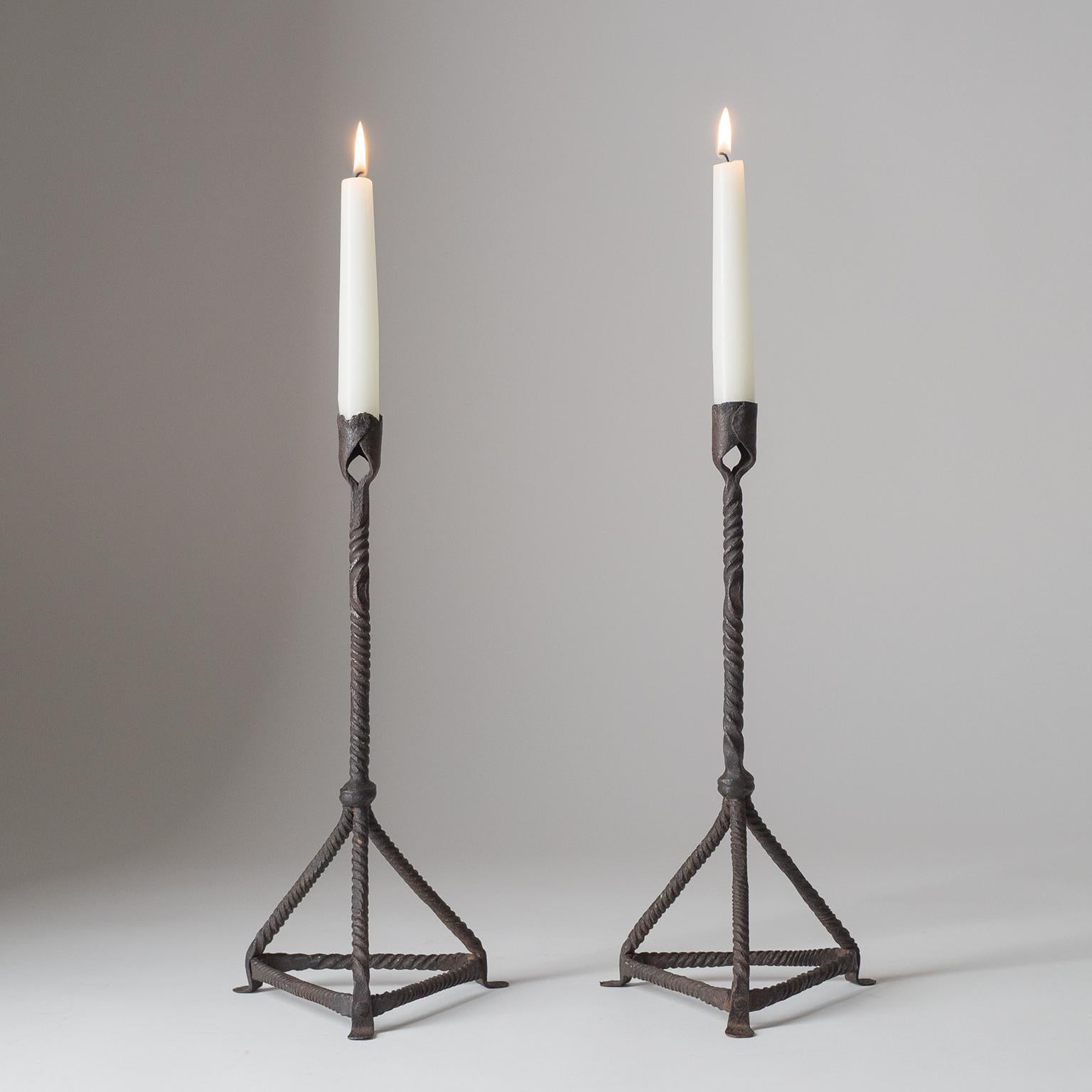 Pair of primitive French forged iron candlesticks, early 20th century.