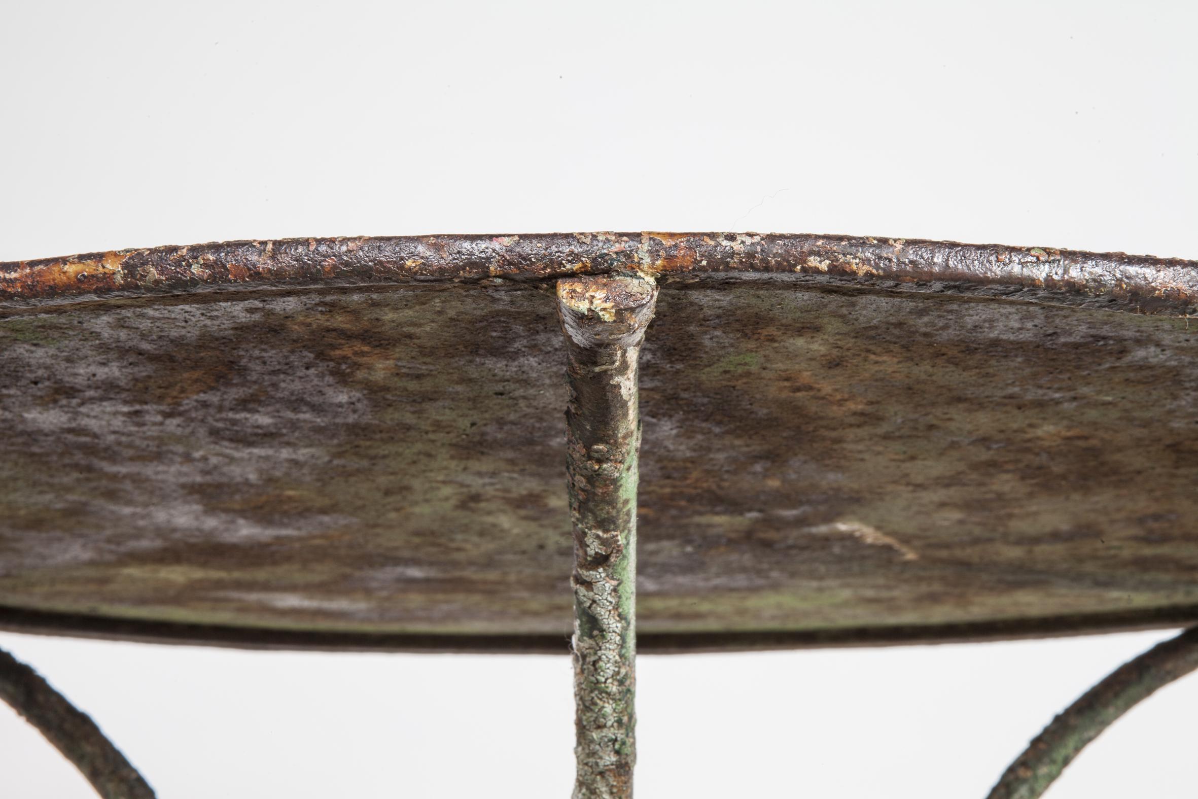 Outdoor iron French bistro table with amazing patina.
