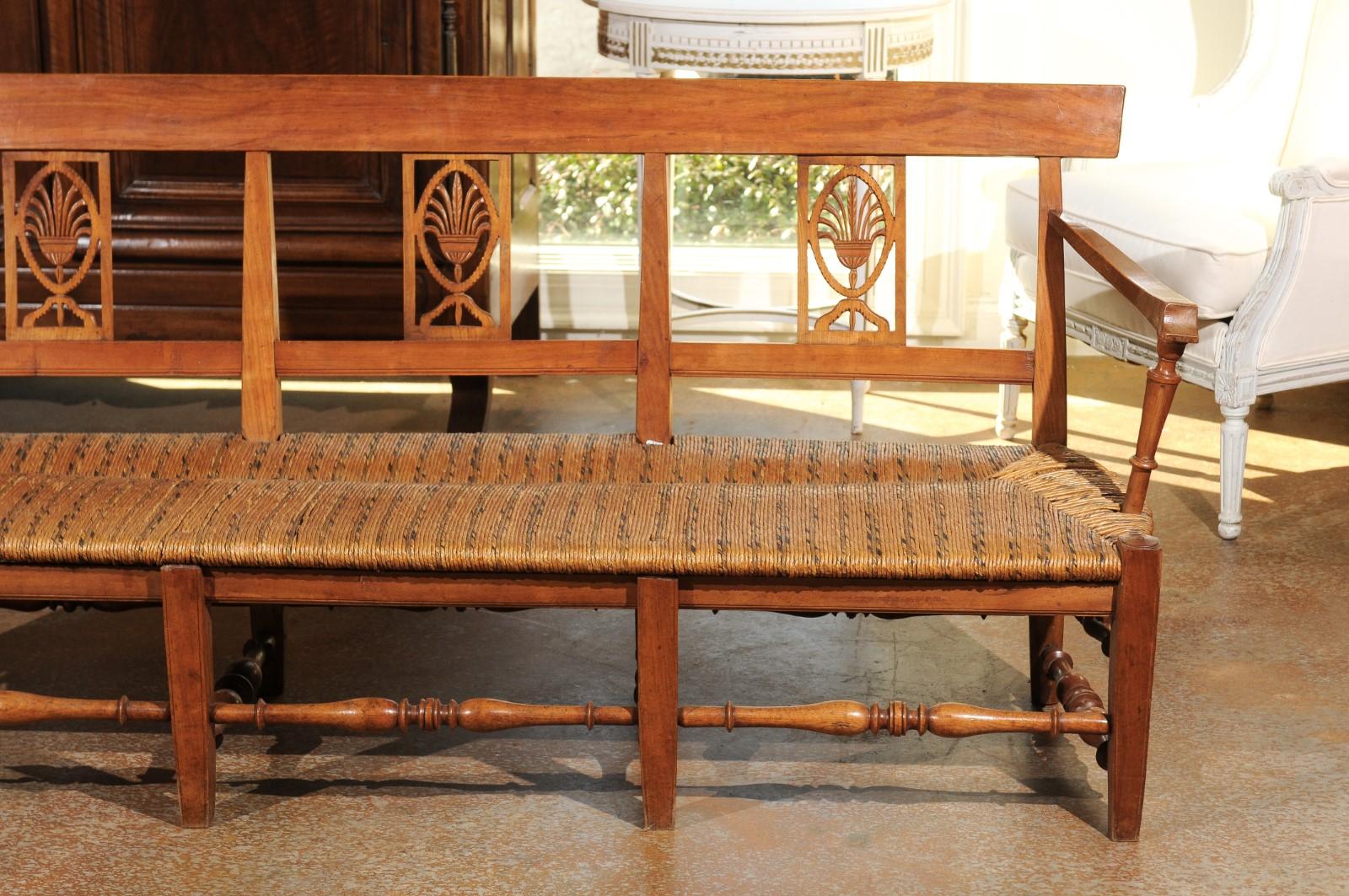 Hand-Carved French Provençal Directoire Style 1810s Wooden Bench with Stylized Palmettes