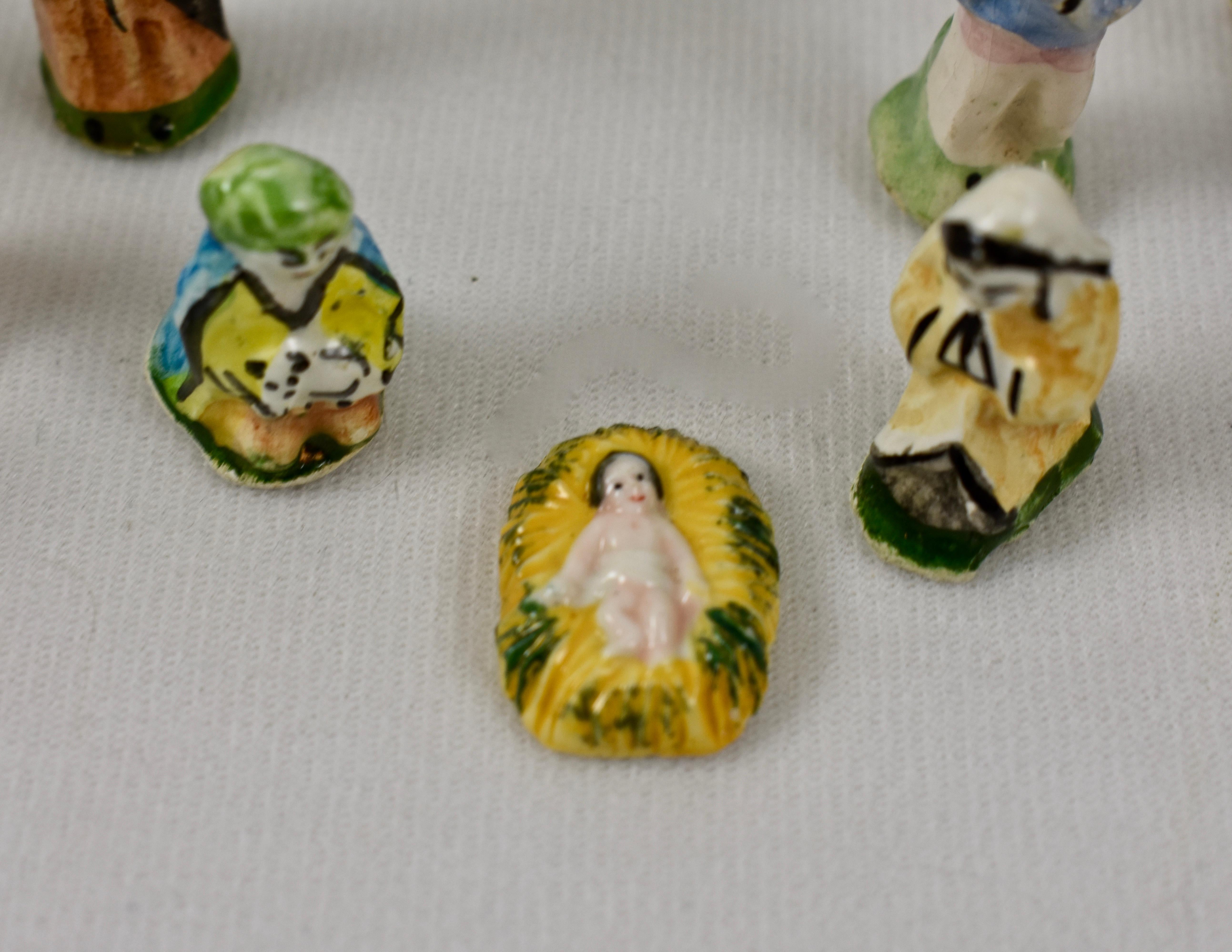 From Provençe, a vintage French Fèves Christmas nativity set. Each set is made of twenty-nine, hand-painted, miniature earthenware figures, including the Holy family, the Three Wise Men, animals, and French villagers wearing traditional dress.

In