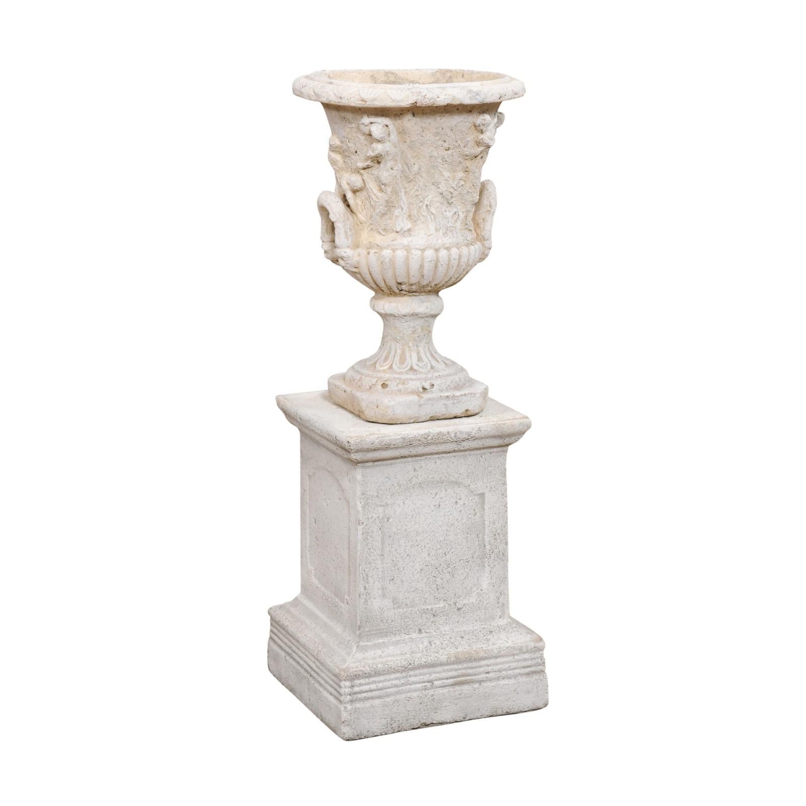 A French stone Provençale jardinière from the second half of the 19th century, with low-relief carved scenes and handles. Born in Provence at the end of the reign of France's last Emperor Napoleon III, this jardinière reflects its influence of the