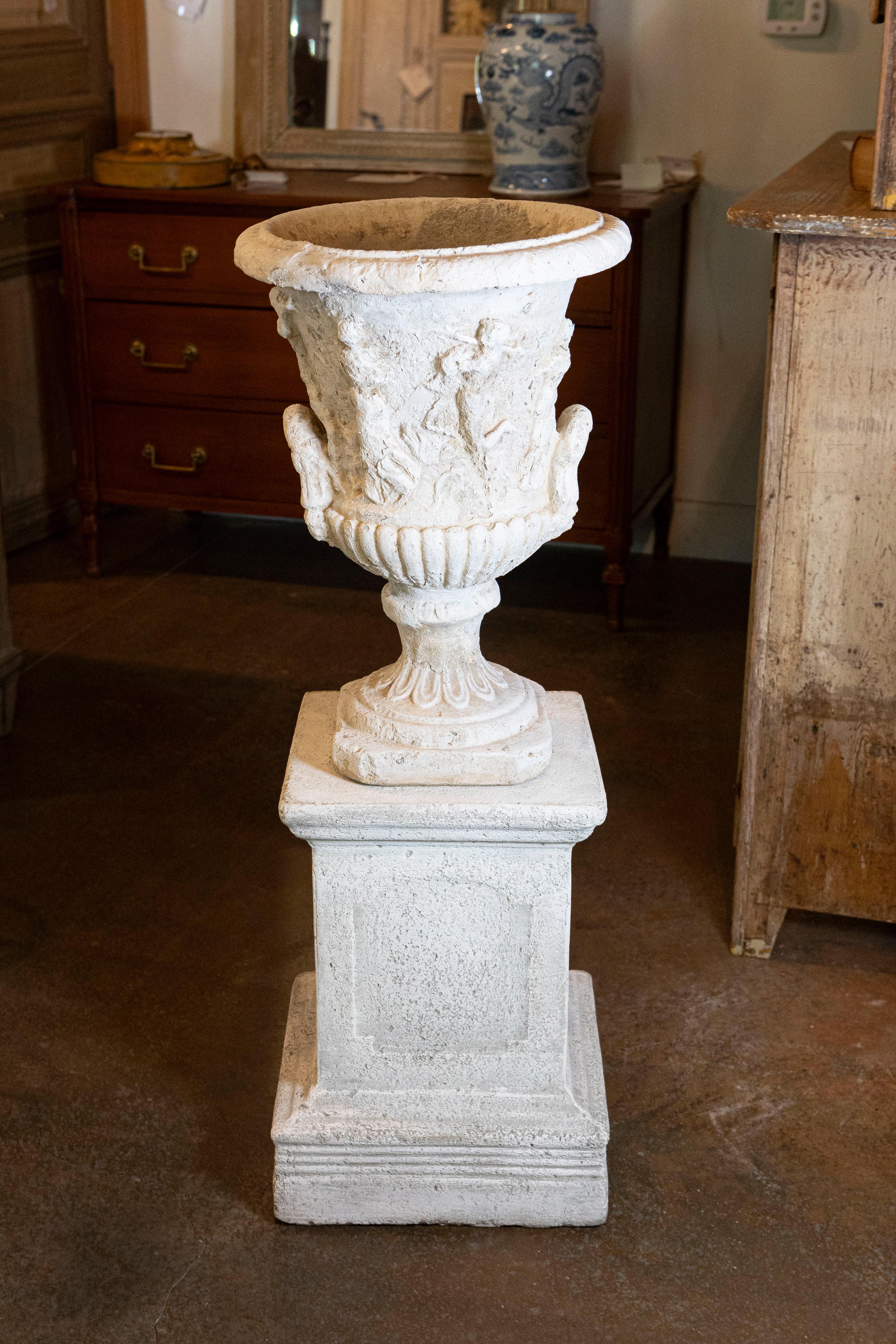 A French stone Provençale jardinière from the second half of the 19th century, with low-relief carved scenes and handles. Born in Provence at the end of the reign of France's last Emperor Napoleon III, this jardinière reflects its influence of the