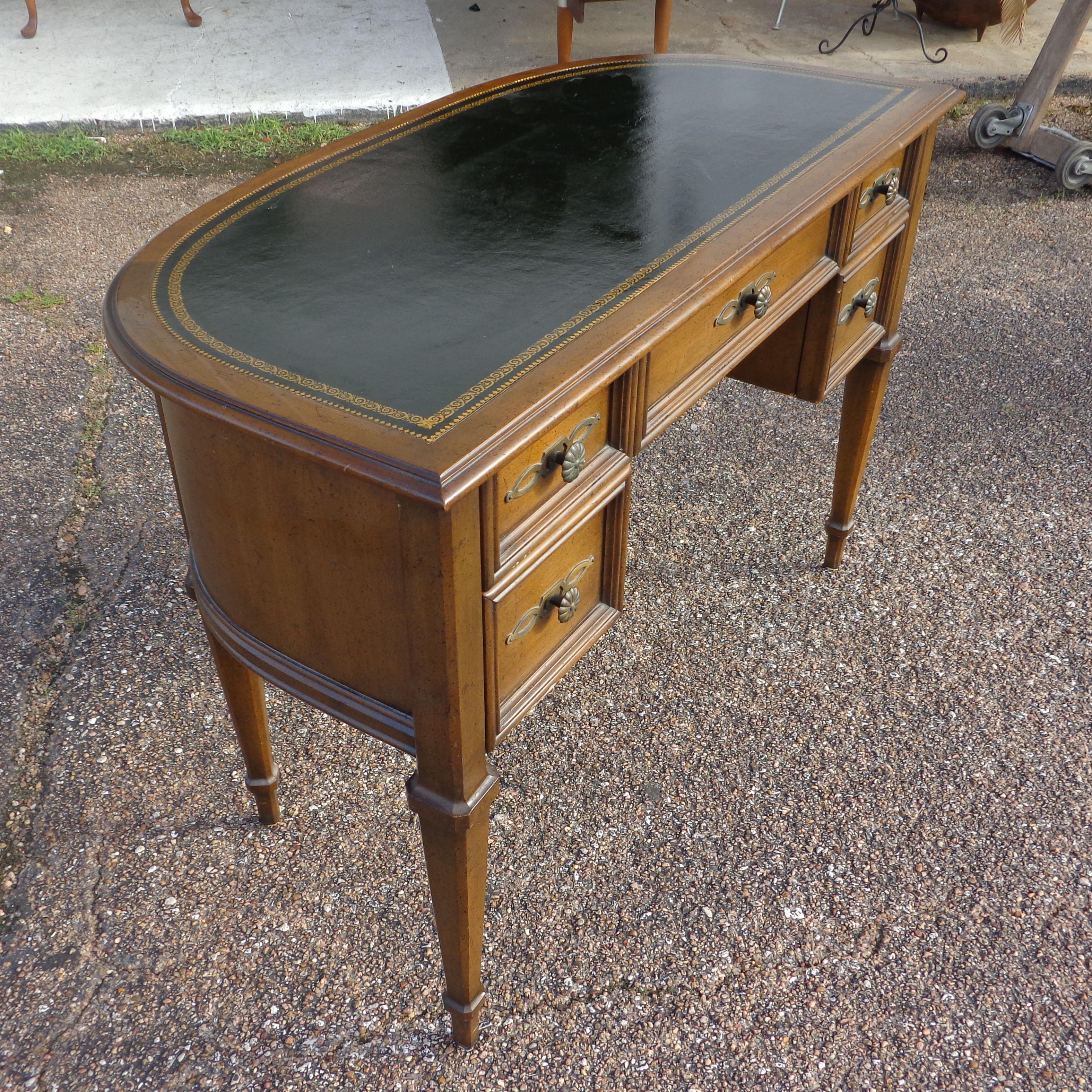 French Provencial writing desk by Sligh Furniture

Vintage leather top half moon desk by Sligh. Walnut and tooled black leather top. Five drawers with brass filigreed pulls and plates. Finished back.
 
 
Measures: Height: 29.5 inches
Width:
