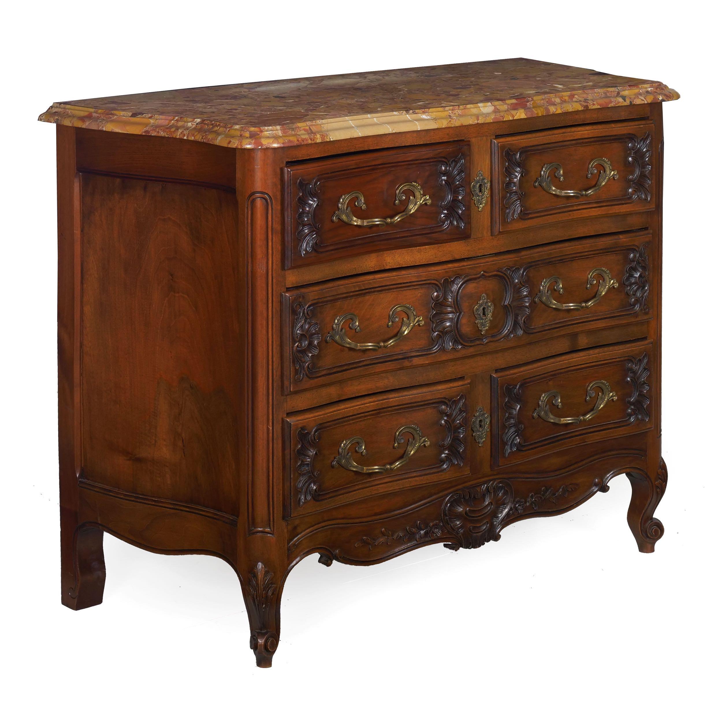 French provincial carved walnut Breche d'Alep top commode,
circa early 20th century with excellent original cast brass pulls
Item # 007YZQ30K 

A most attractive shaped commode with a conforming breche d'alep stone top, the drawers are an