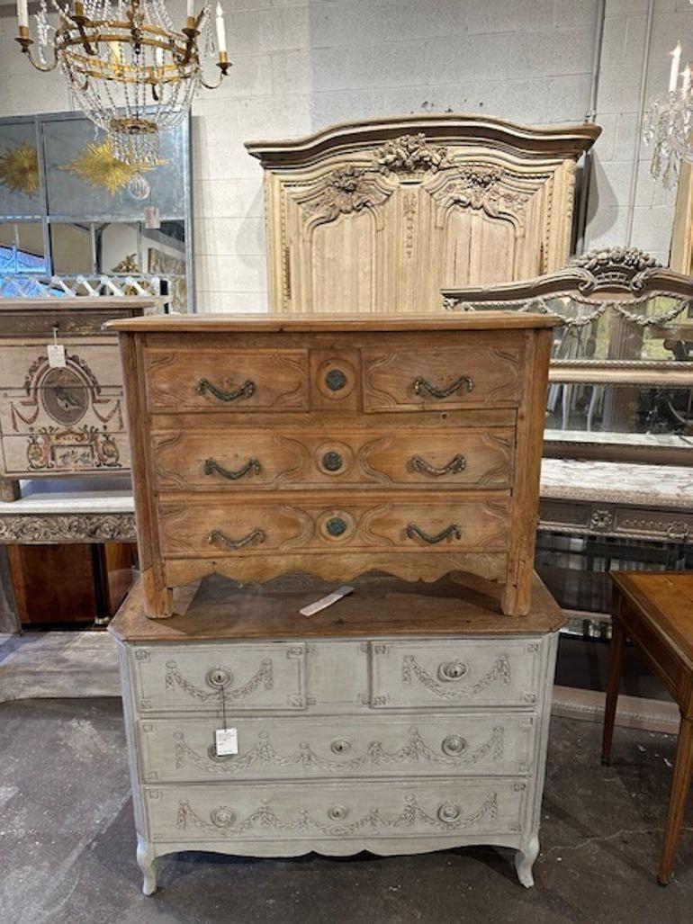 18th century French provincial carved and bleached oak commode. Circa 1780. Adds warmth and charm to any room!