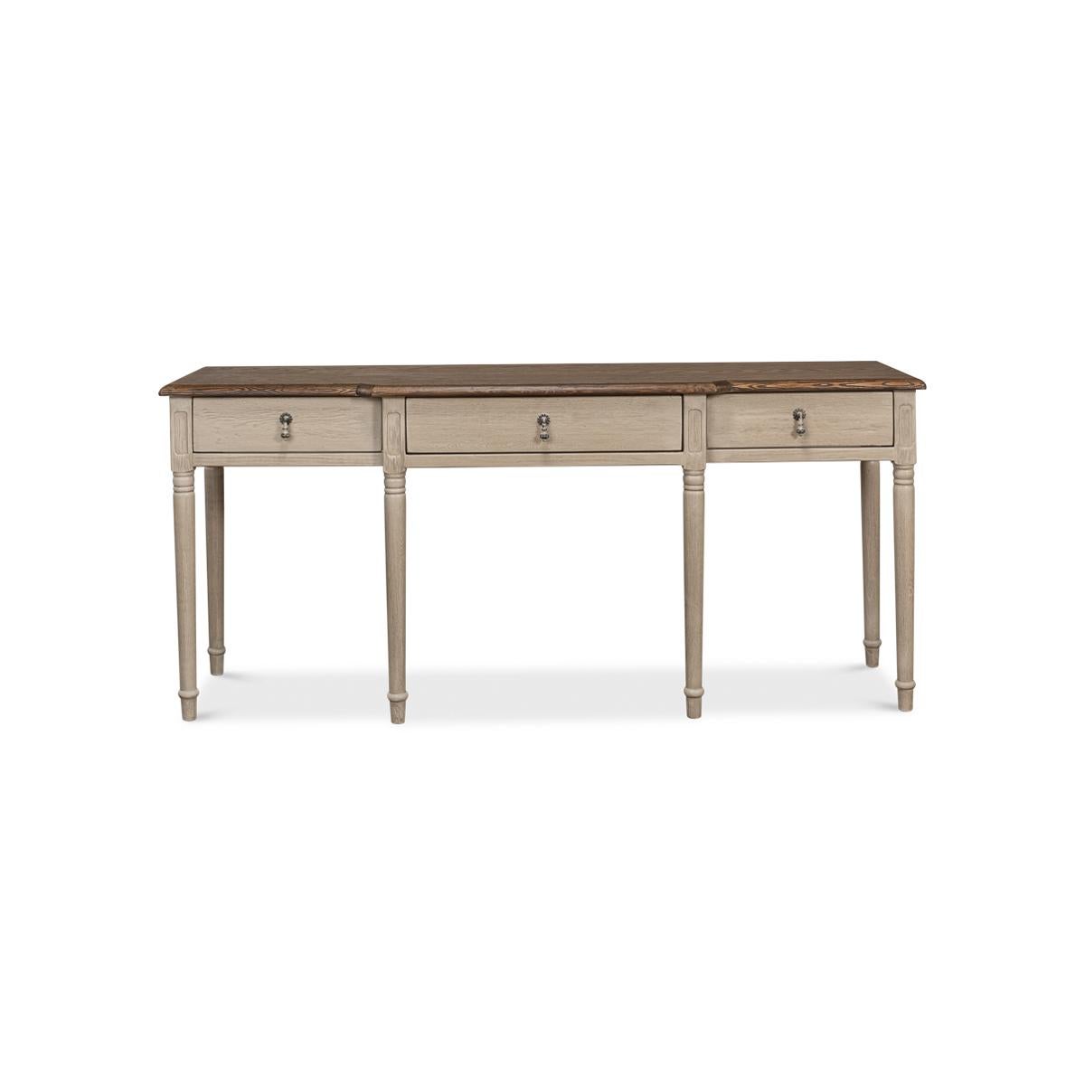 French Provincial Breakfront Console Table, the perfect addition to any elegant and sophisticated living space. This beautiful piece boasts a natural finish oak top with a molded edge, creating a sleek and refined look.

The top is contrasted by a