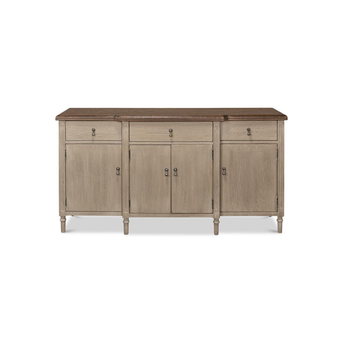 The perfect addition to any elegant and sophisticated dining or living space, this beautiful piece boasts a natural finish oak top with a molded edge, creating a sleek and refined look. The top is contrasted by a soft grey painted base that adds a