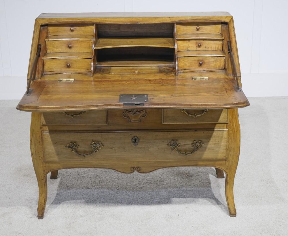 You are viewing a gorgeous French antique bureau desk in cherry wood
Very pretty piece with floral motif in relief in the middle Features two drawers so ample storage
Top opens down to reveal writing surface with various drawers and cubby