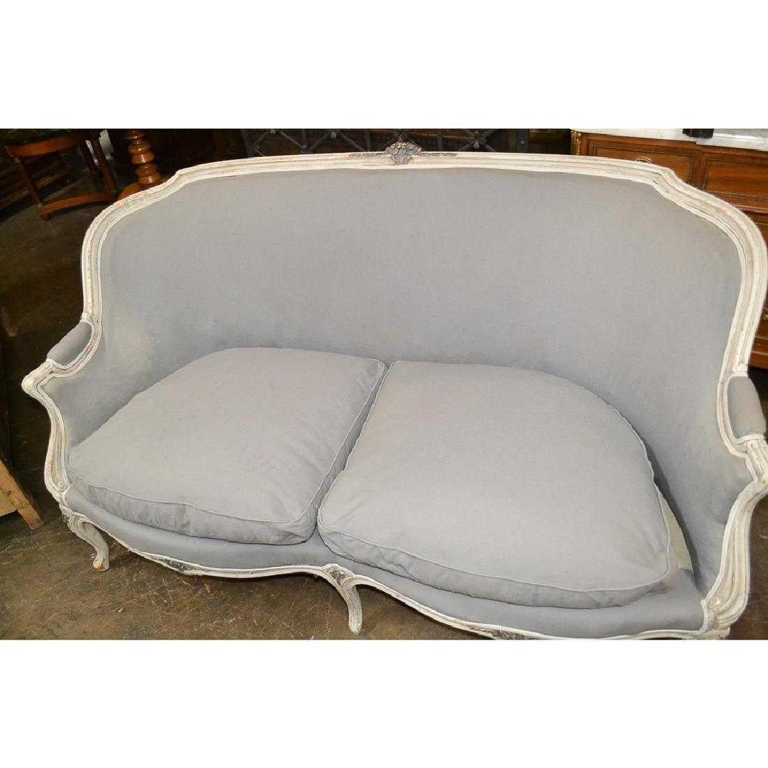 Superb quality French Provincial carved, painted, and upholstered settee. Clean lines. Elegant look.