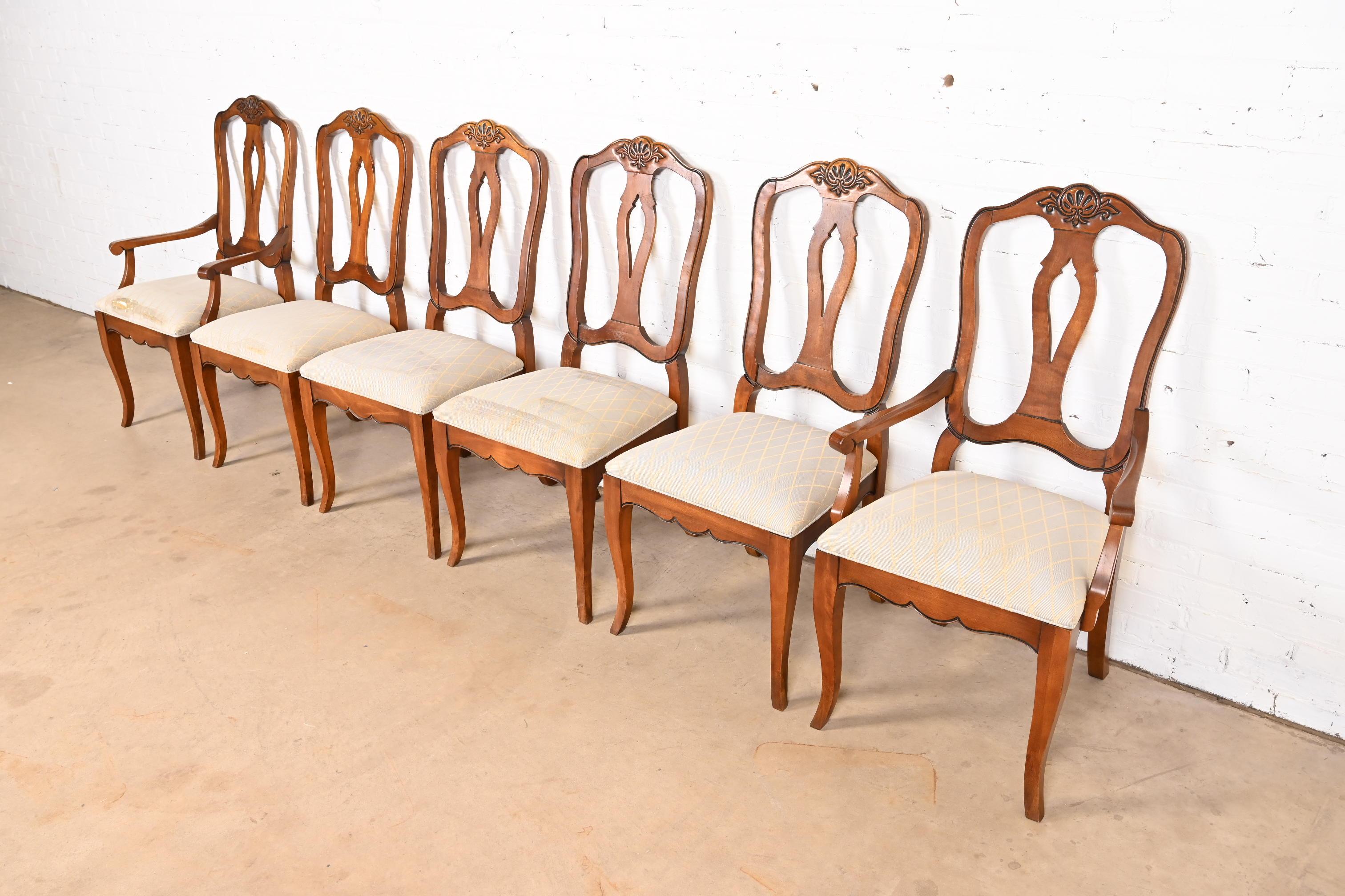 A gorgeous set of six French Provincial or Country French dining chairs

USA, Late 20th Century

Carved solid maple frames, with upholstered seats.

Measures:
Side chairs - 20