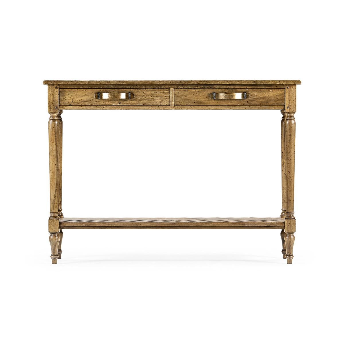 French Provincial console table, with a heavily distressed medium drift finish, this parquet top console has two drawers and under-tier. Bentwood and iron handles contrasting dark geometric inlay to panels. Raised on turned and tapered