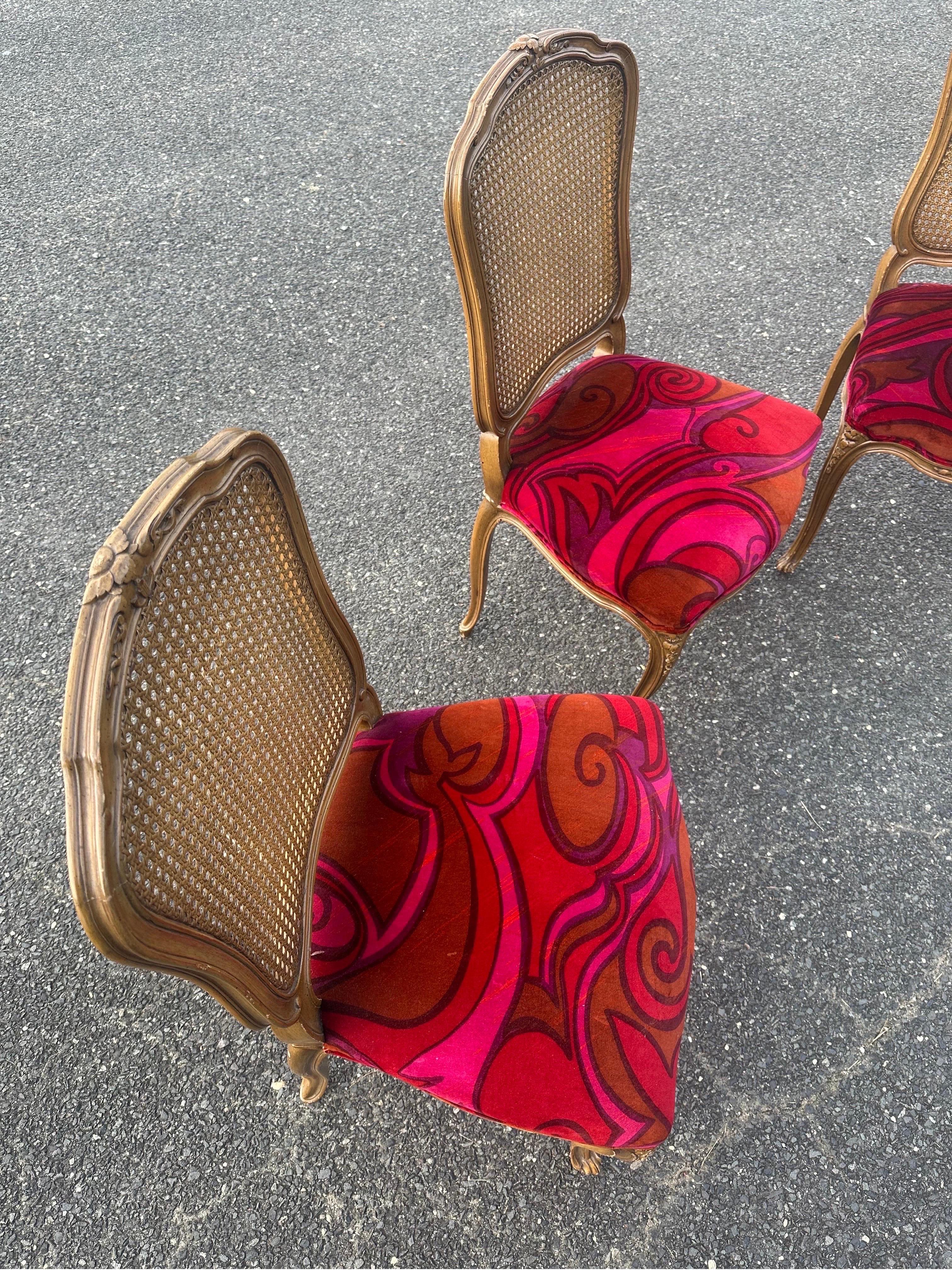 Spring seat dining chairs circa the 1940s reupholstered with JLL velvet seats.

Velvet is extremely vibrant, with piping on edges. 

Chairs are unmarked circa 1940s, spring seats. Comfortable showing some age patina and charm. 