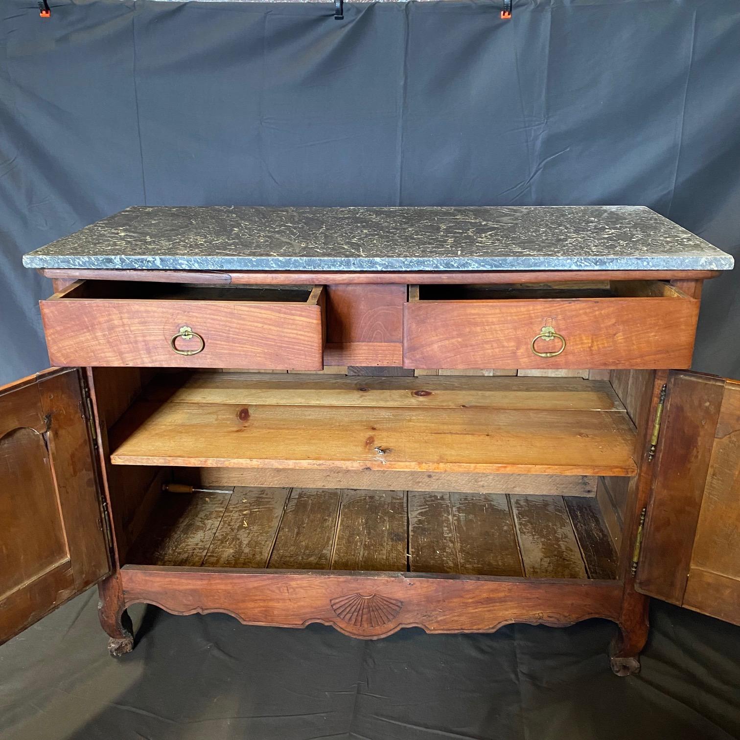 Early 19th century Country French Buffet, entirely hand-crafted from old-growth cherry, and accented with brass hinges, hand etched escutcheons with original key and lovely pulls with rosettes. Look closely to see the pegged mortise & tenon joinery,